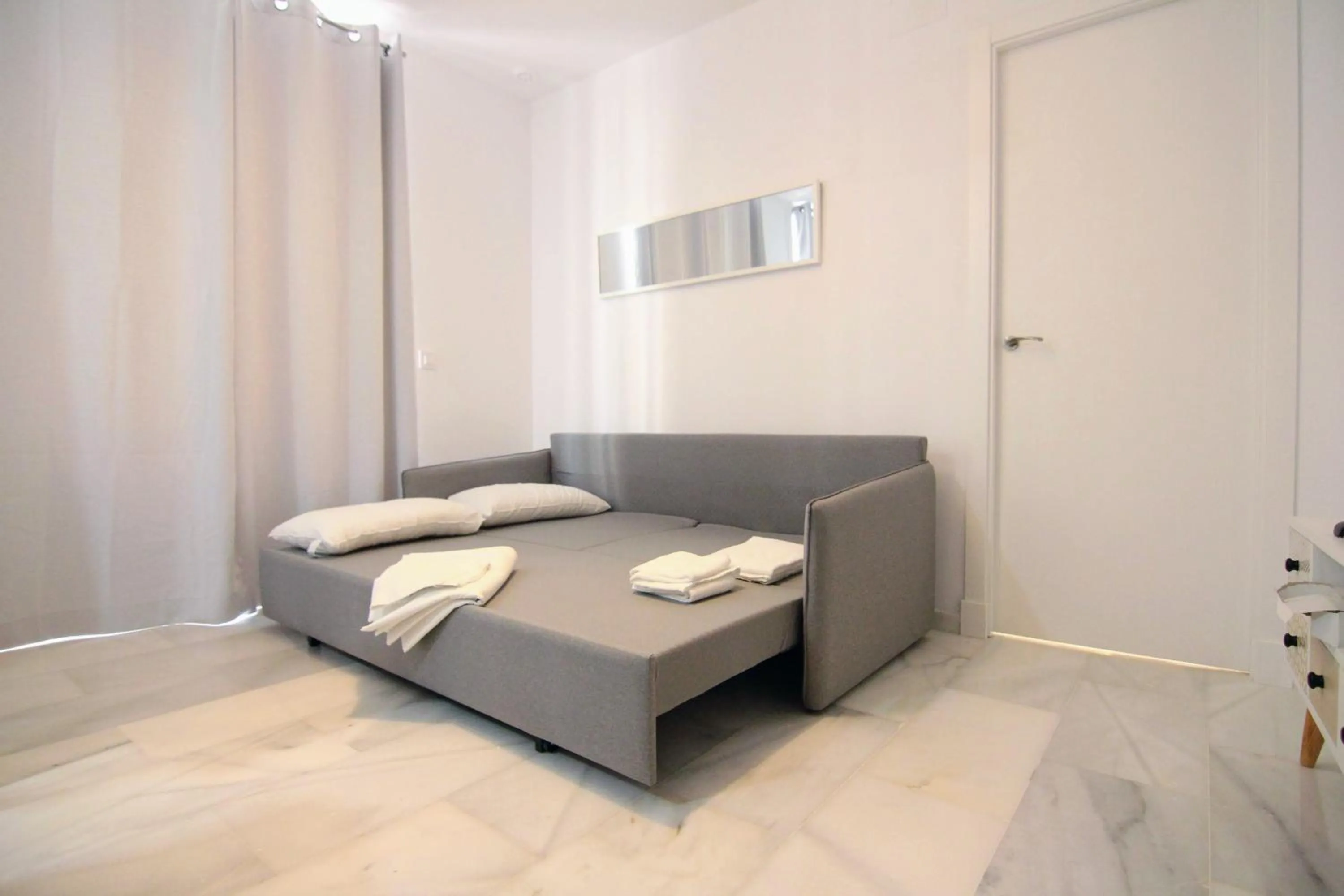 Living room, Bed in Apartamento GRACIA by Cadiz4Rentals
