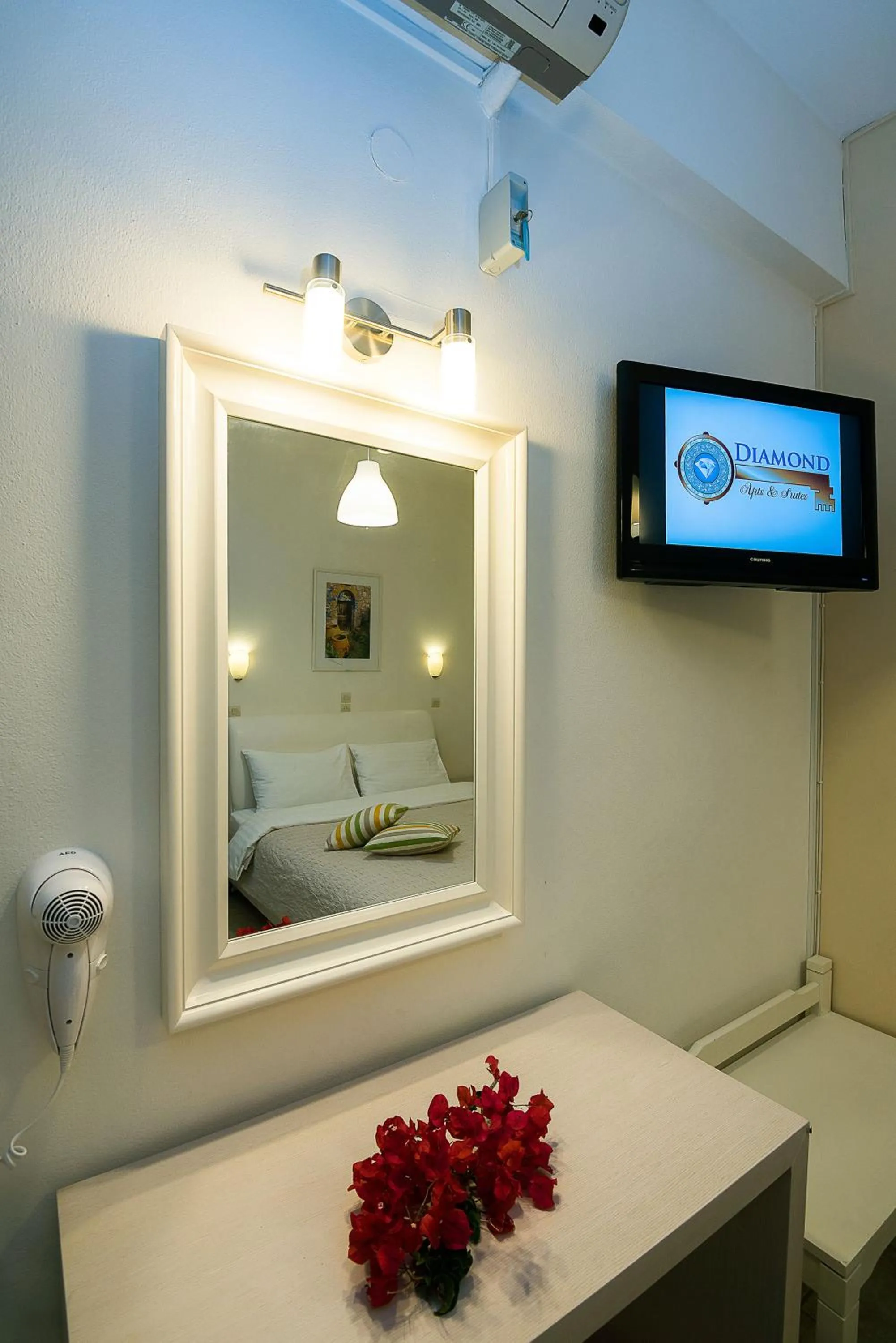 Toilet, Bed in Diamond Apartments & Suites