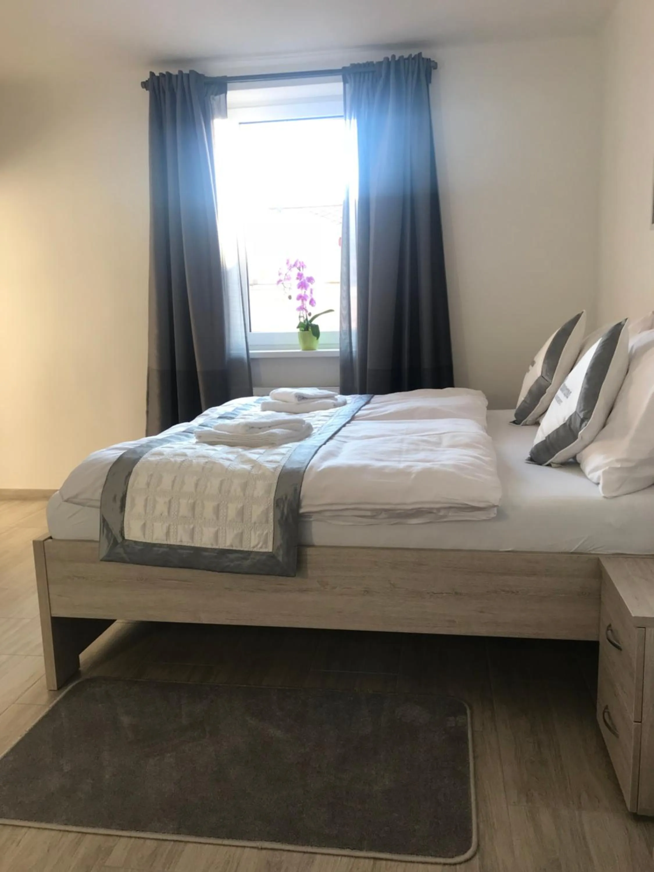 Bed in Panorama Apartments