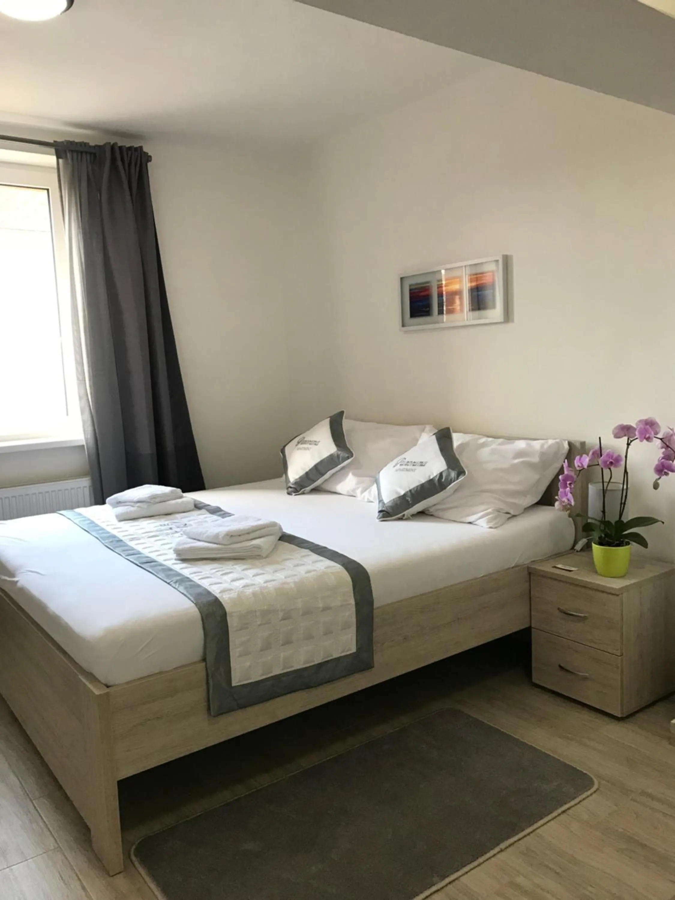 Bed in Panorama Apartments