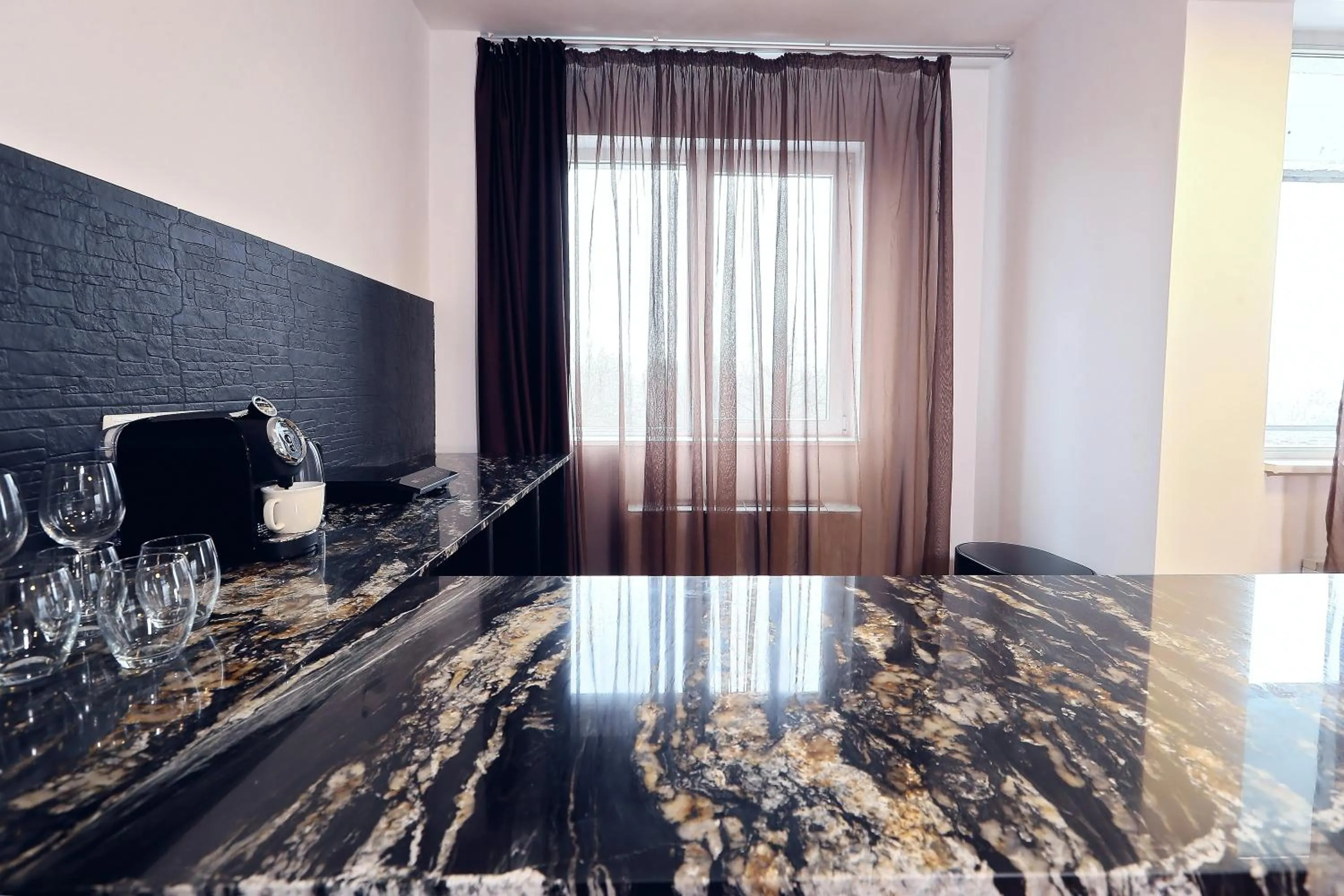 Kitchen or kitchenette in Living In Aparthotel