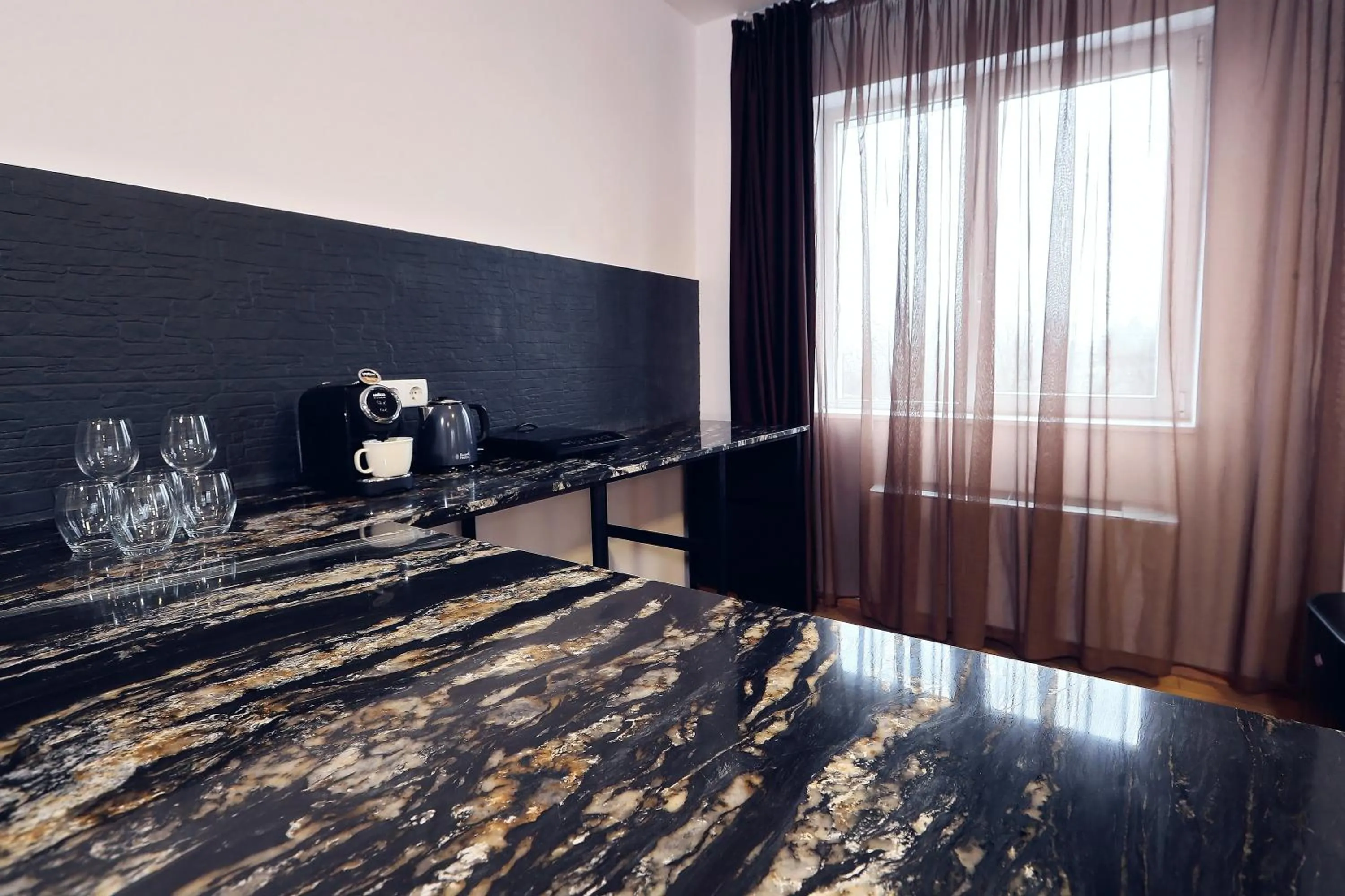 Kitchen or kitchenette in Living In Aparthotel