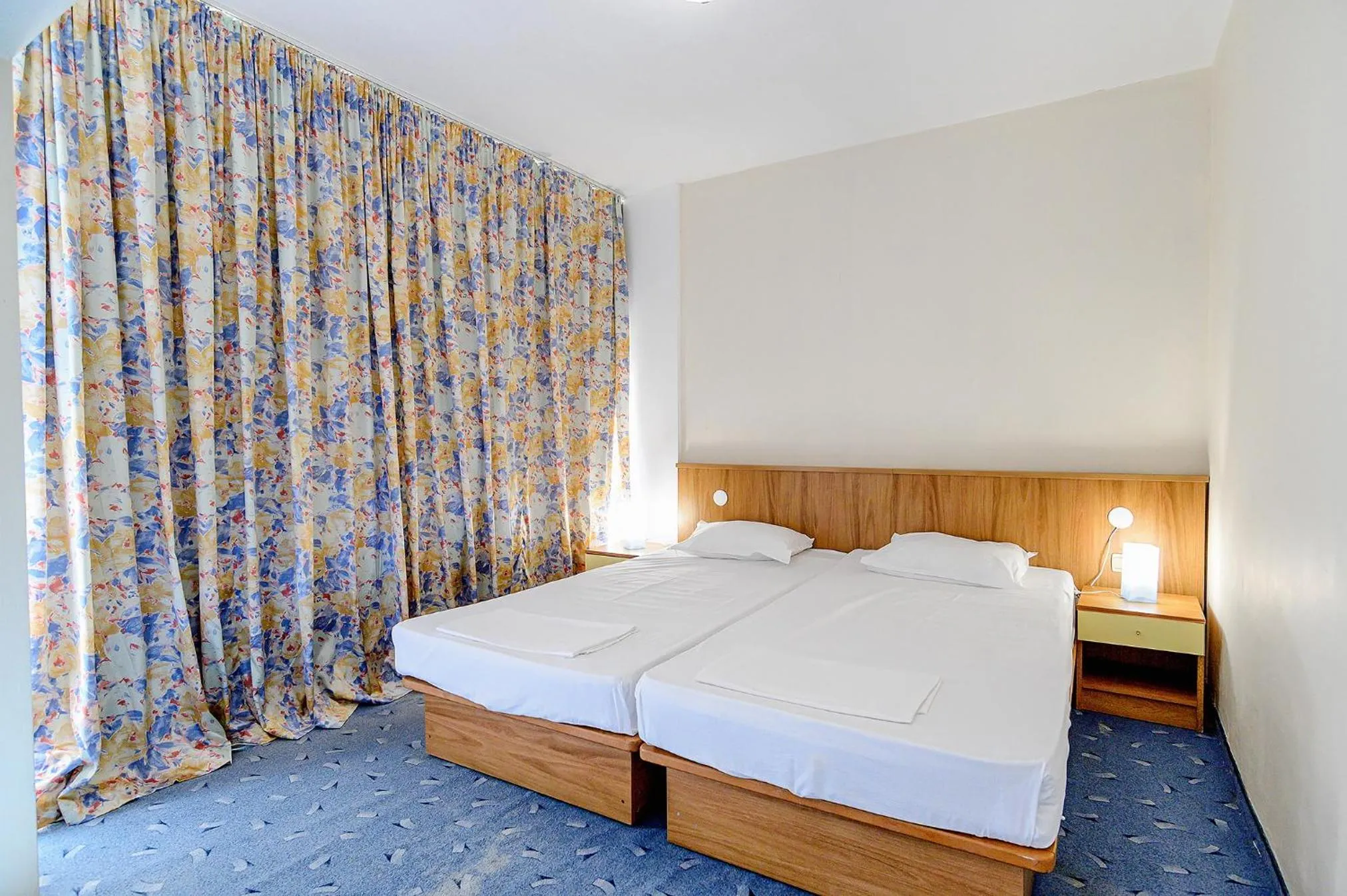 Bed in International House of Journalists Resort