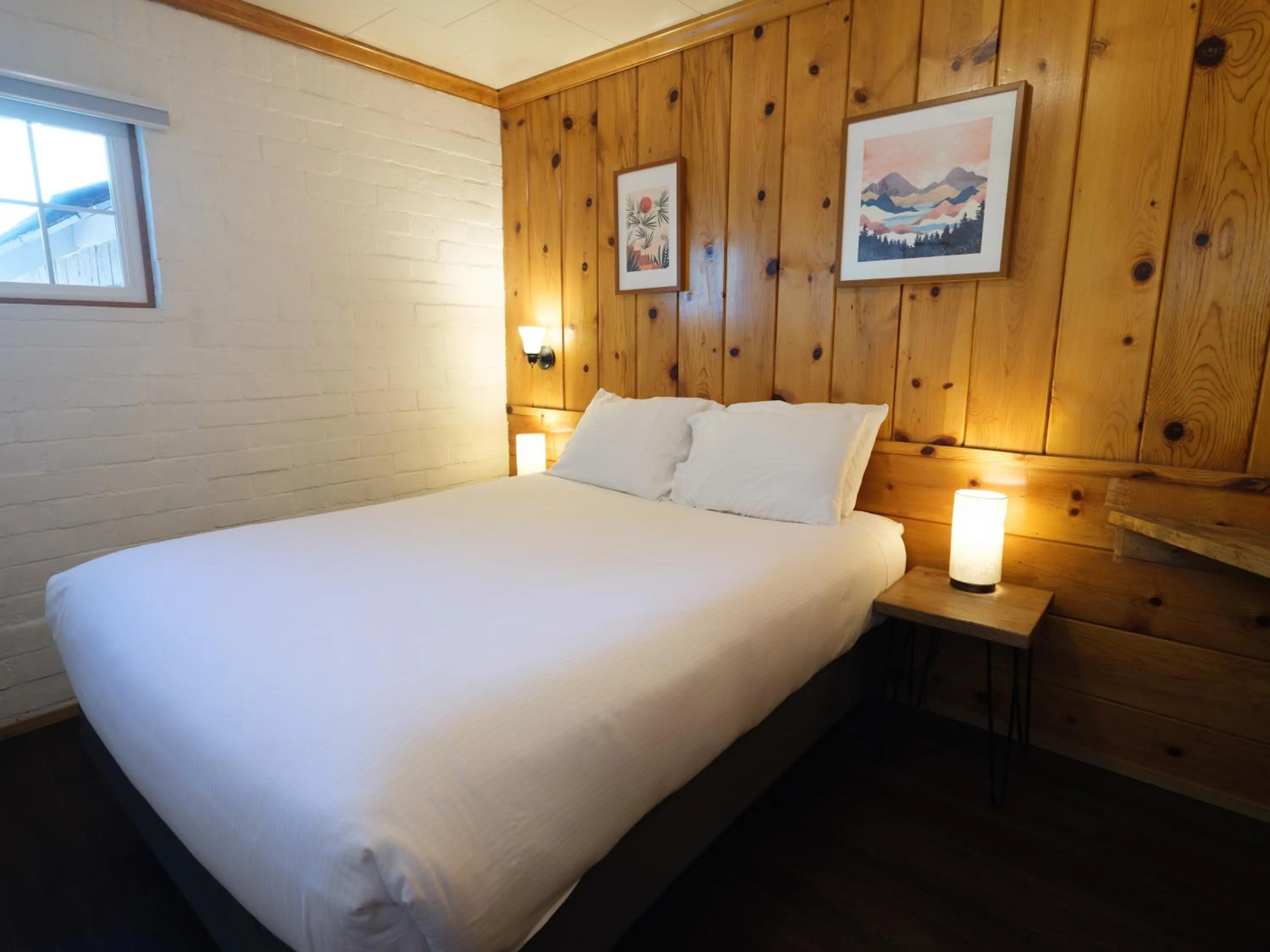 Bed in Lake Front Cabins