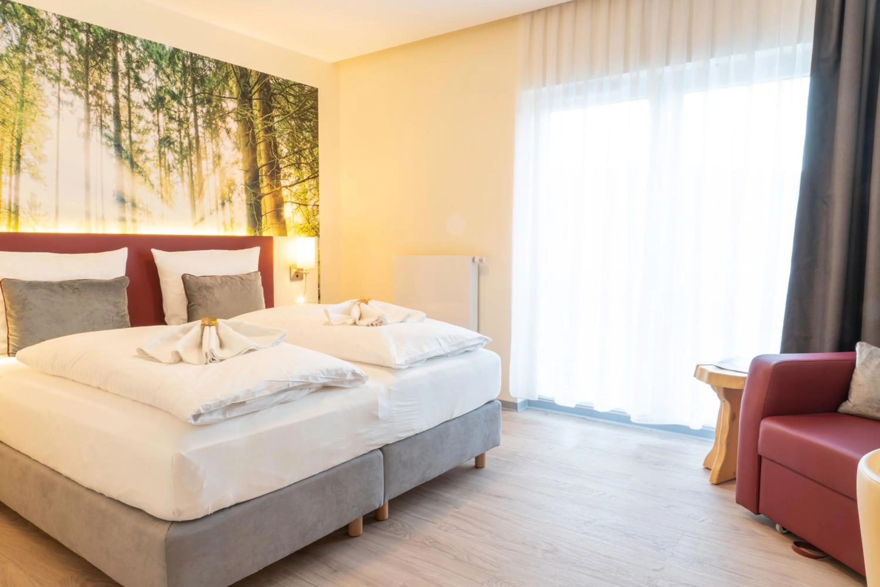 Seating area, Bed in Mythenresort Heimdall