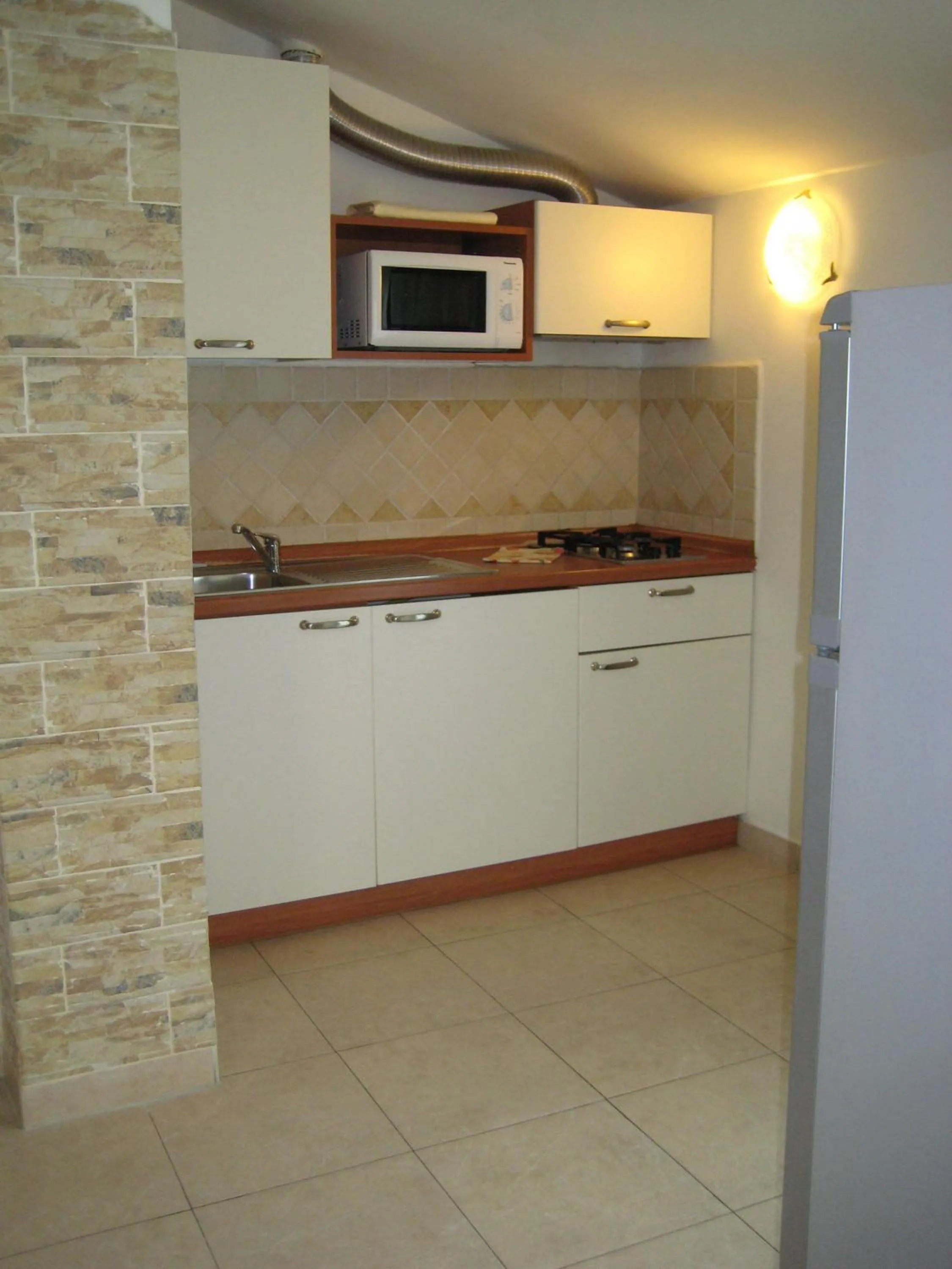 Kitchen or kitchenette in Residence La Villetta