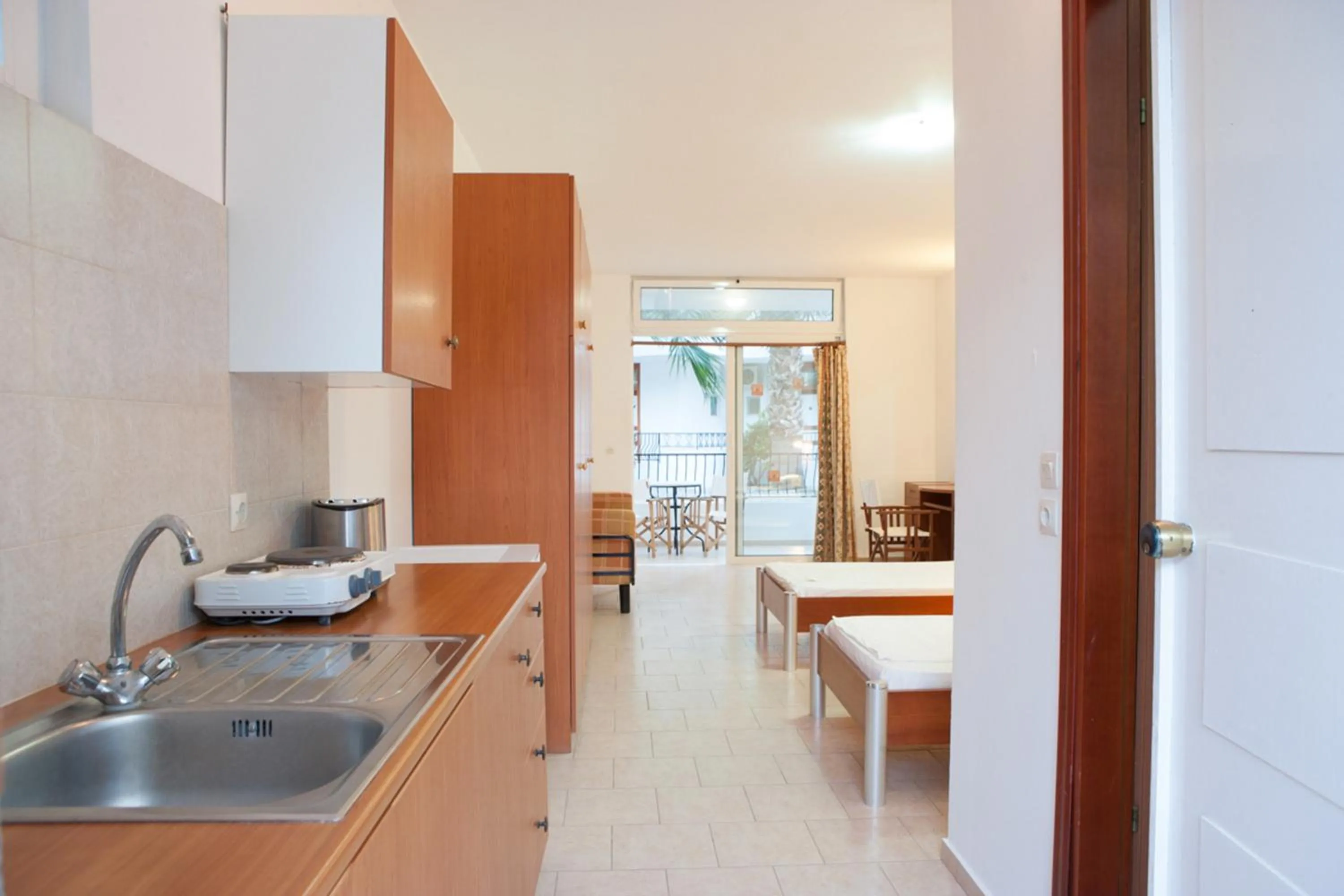 Kitchen or kitchenette in Coliseum Studios & Apartments