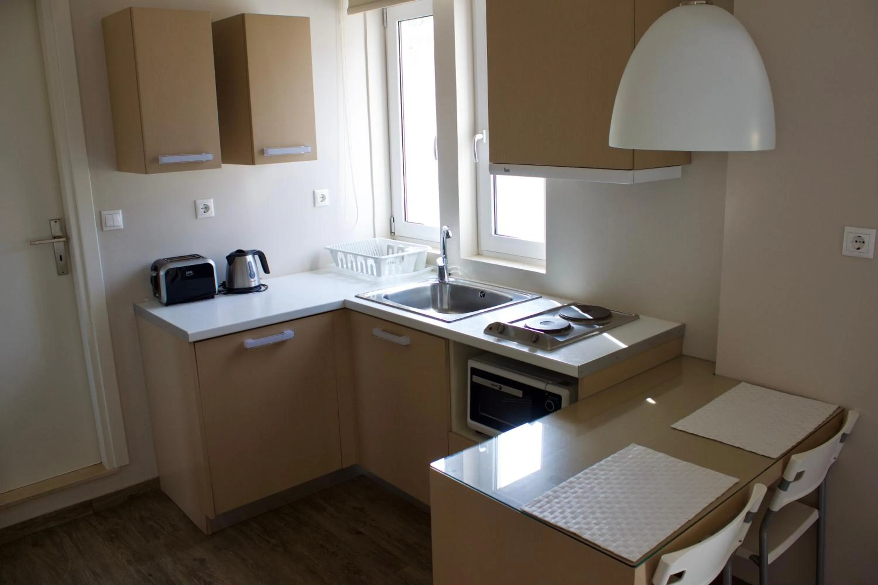 Kitchen or kitchenette in Notos Luxury Studios