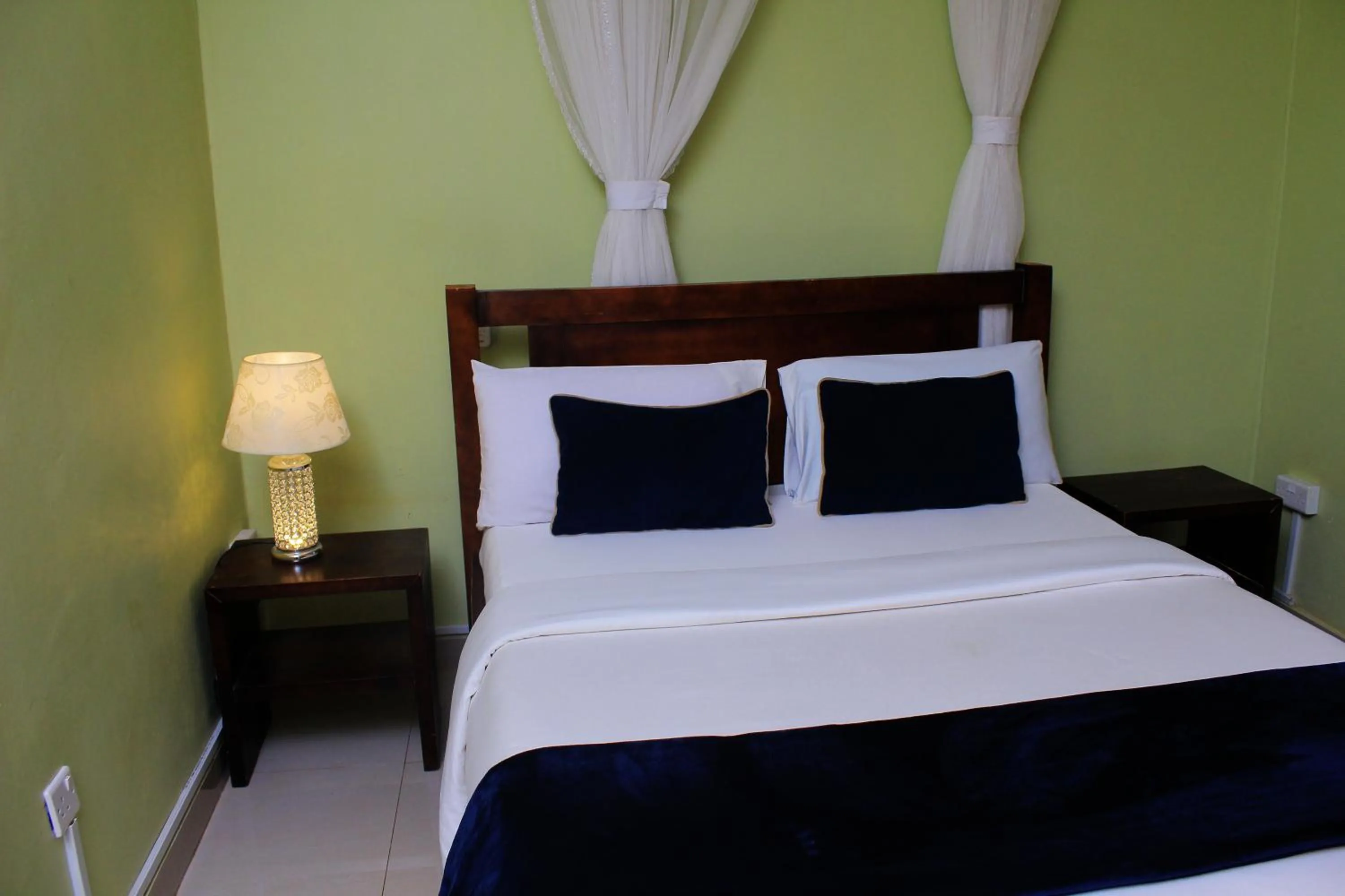 Bed in MAMIKKI Hotel Apartments