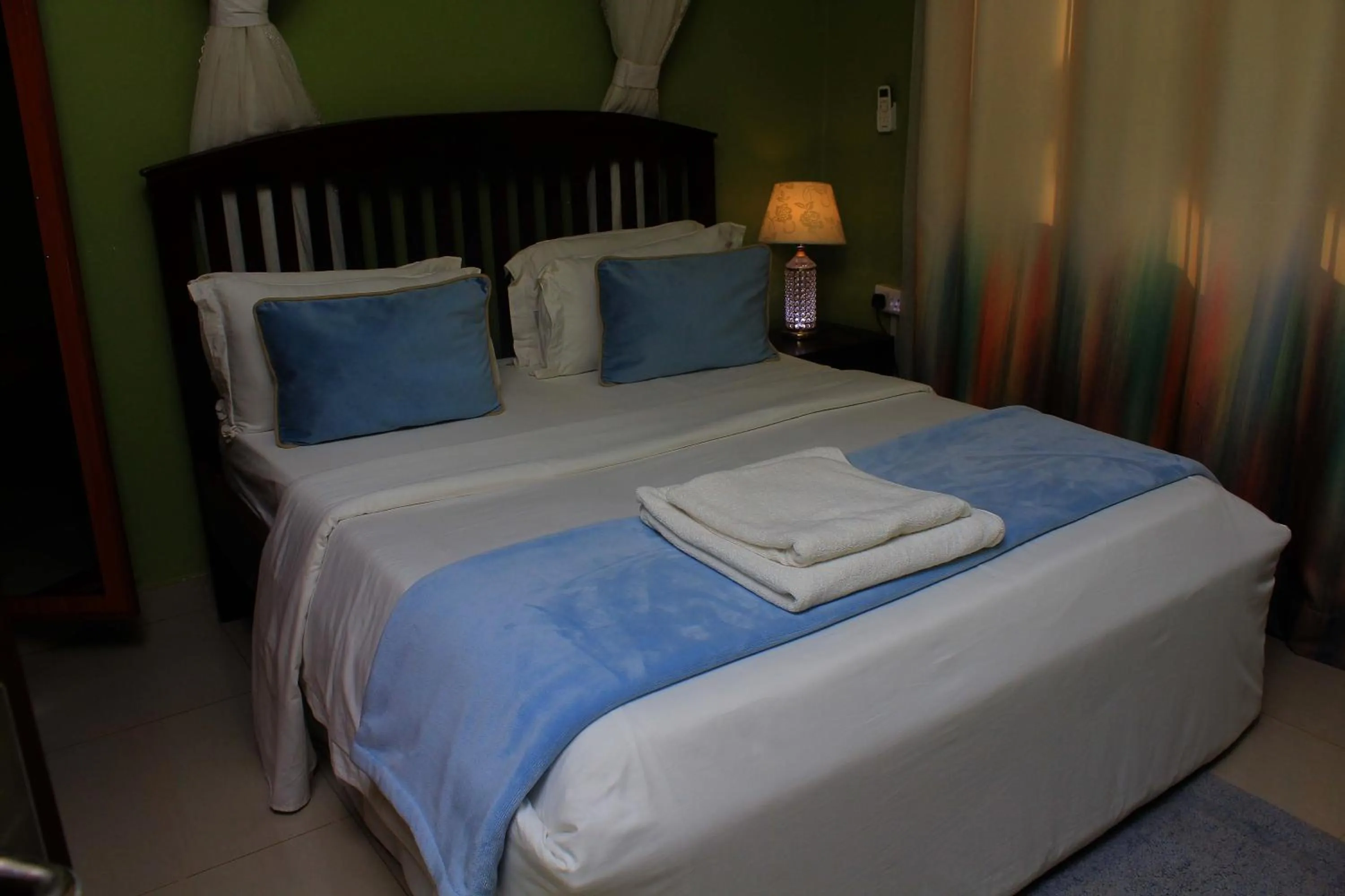 Bed in MAMIKKI Hotel Apartments