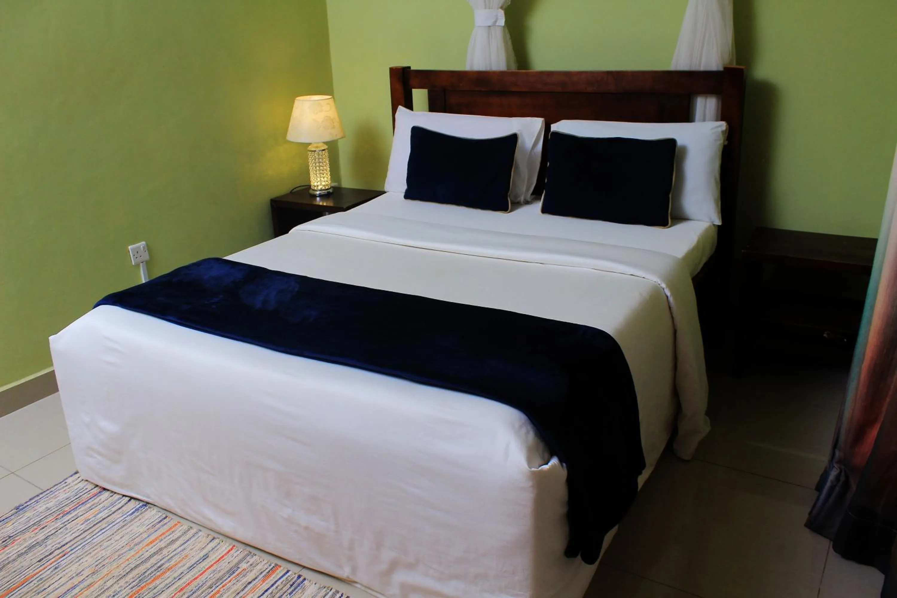 Bed in MAMIKKI Hotel Apartments