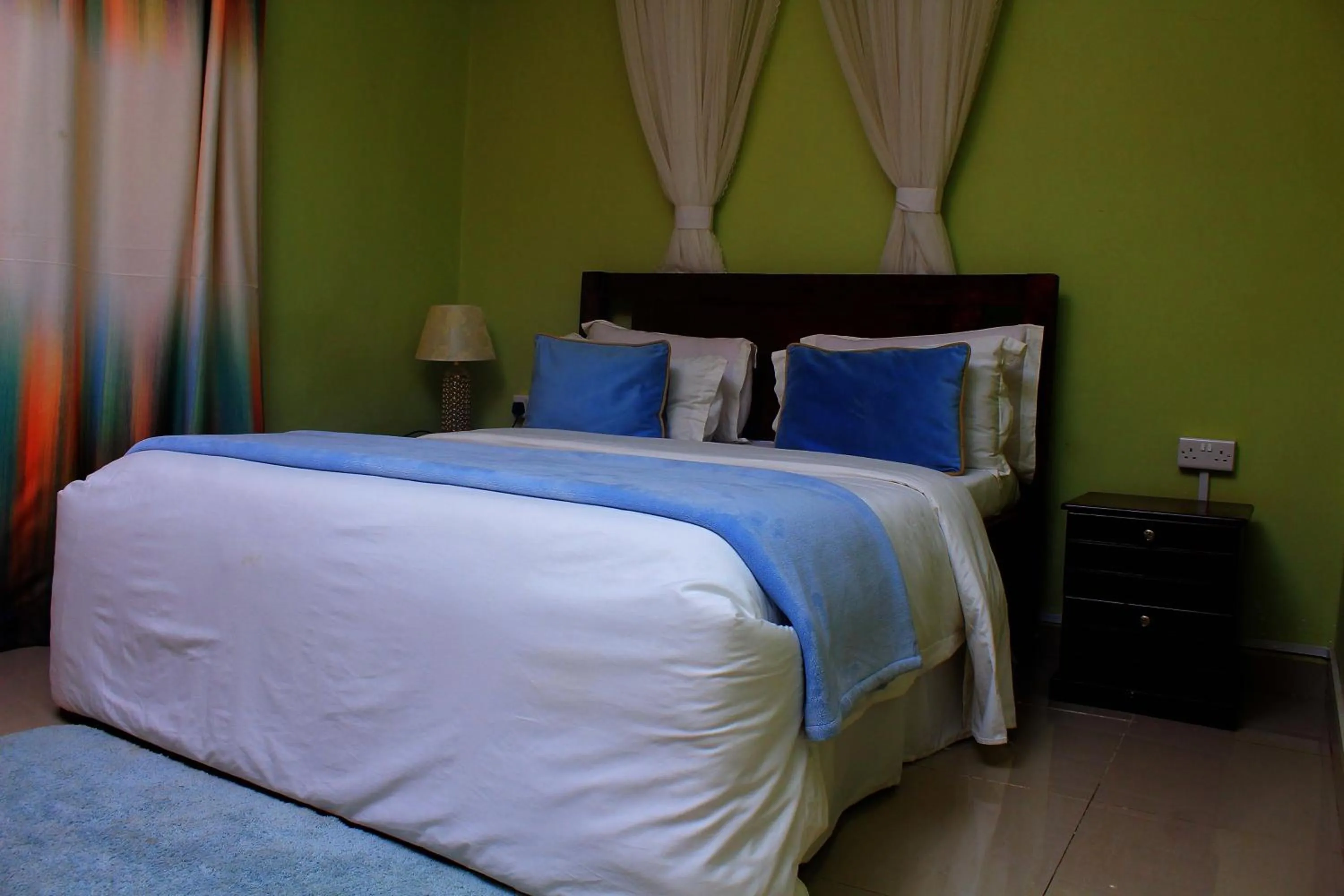 Bed in MAMIKKI Hotel Apartments