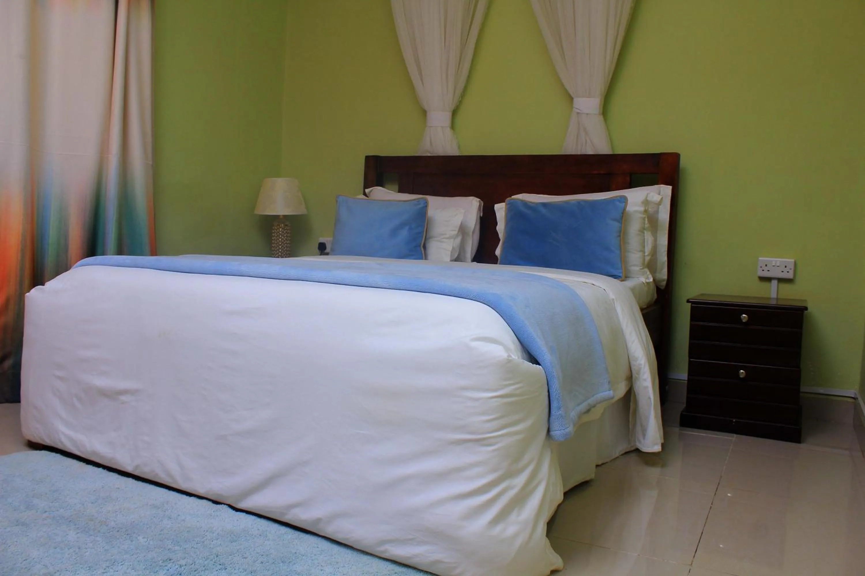 Bed in MAMIKKI Hotel Apartments