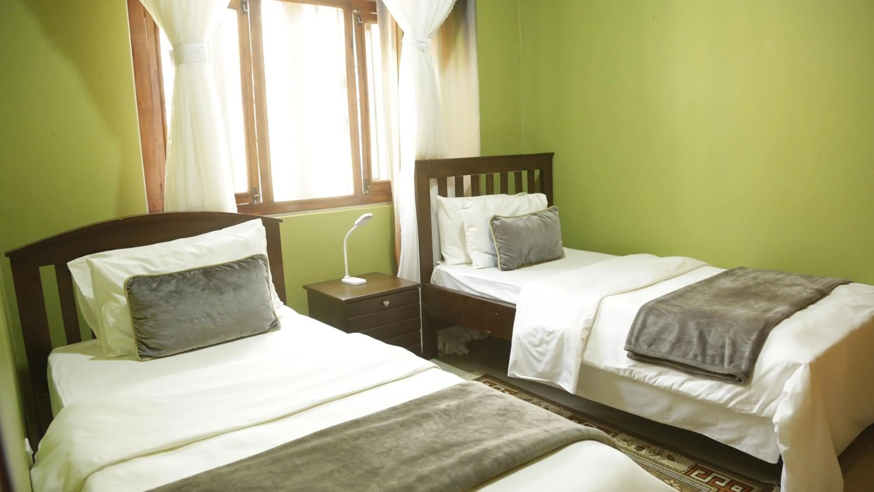 Bed in MAMIKKI Hotel Apartments