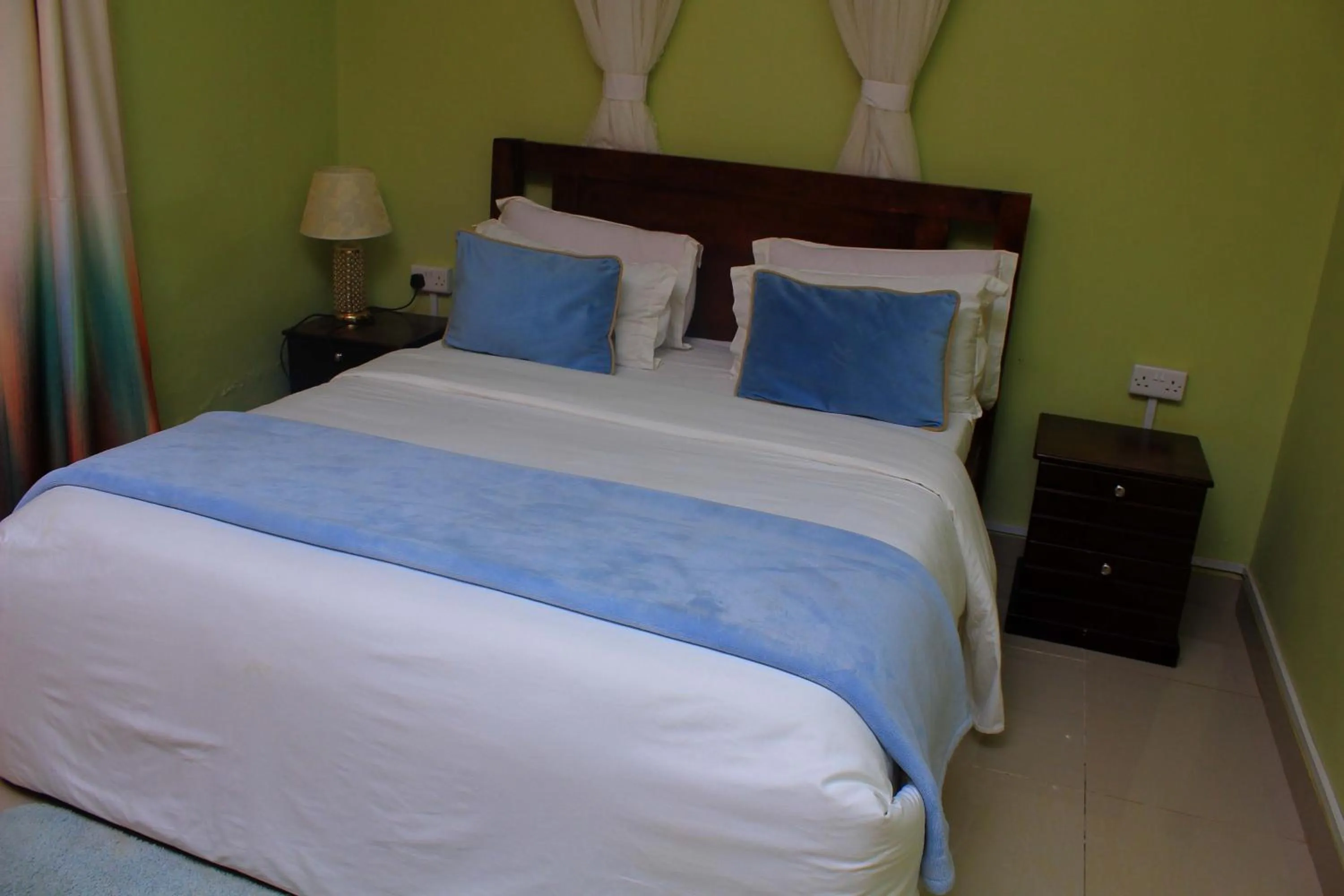 Bed in MAMIKKI Hotel Apartments