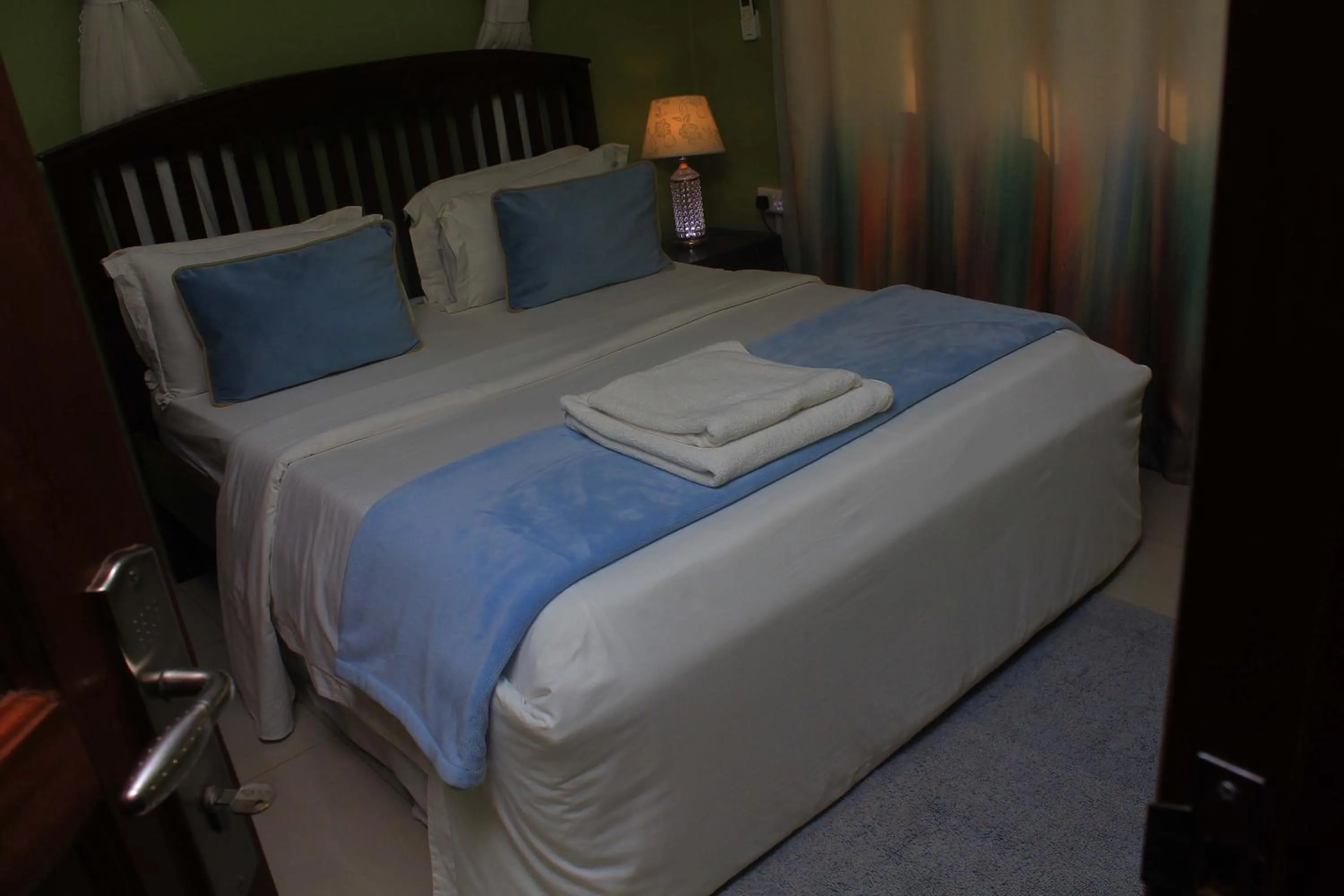 Bed in MAMIKKI Hotel Apartments