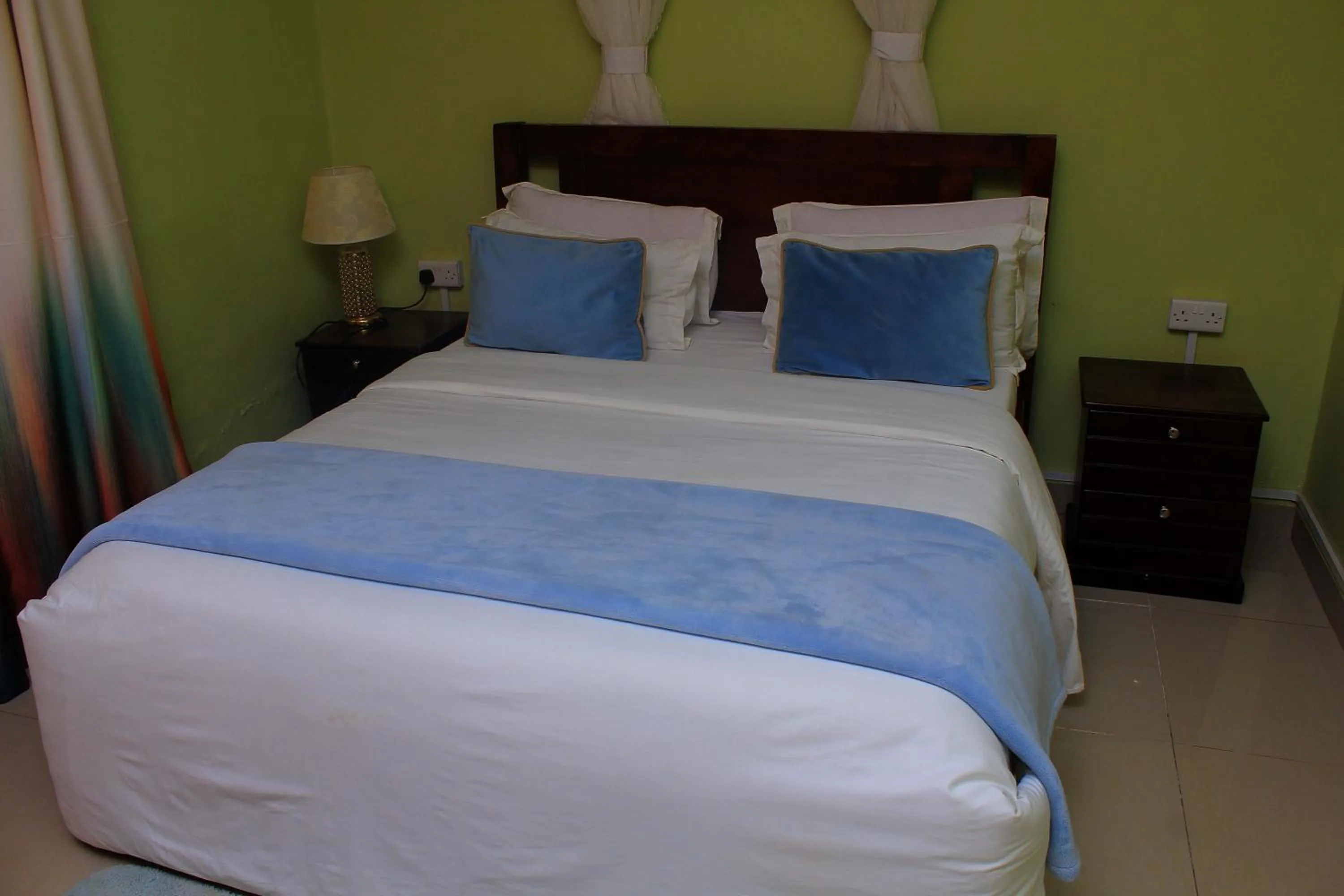 Bed in MAMIKKI Hotel Apartments