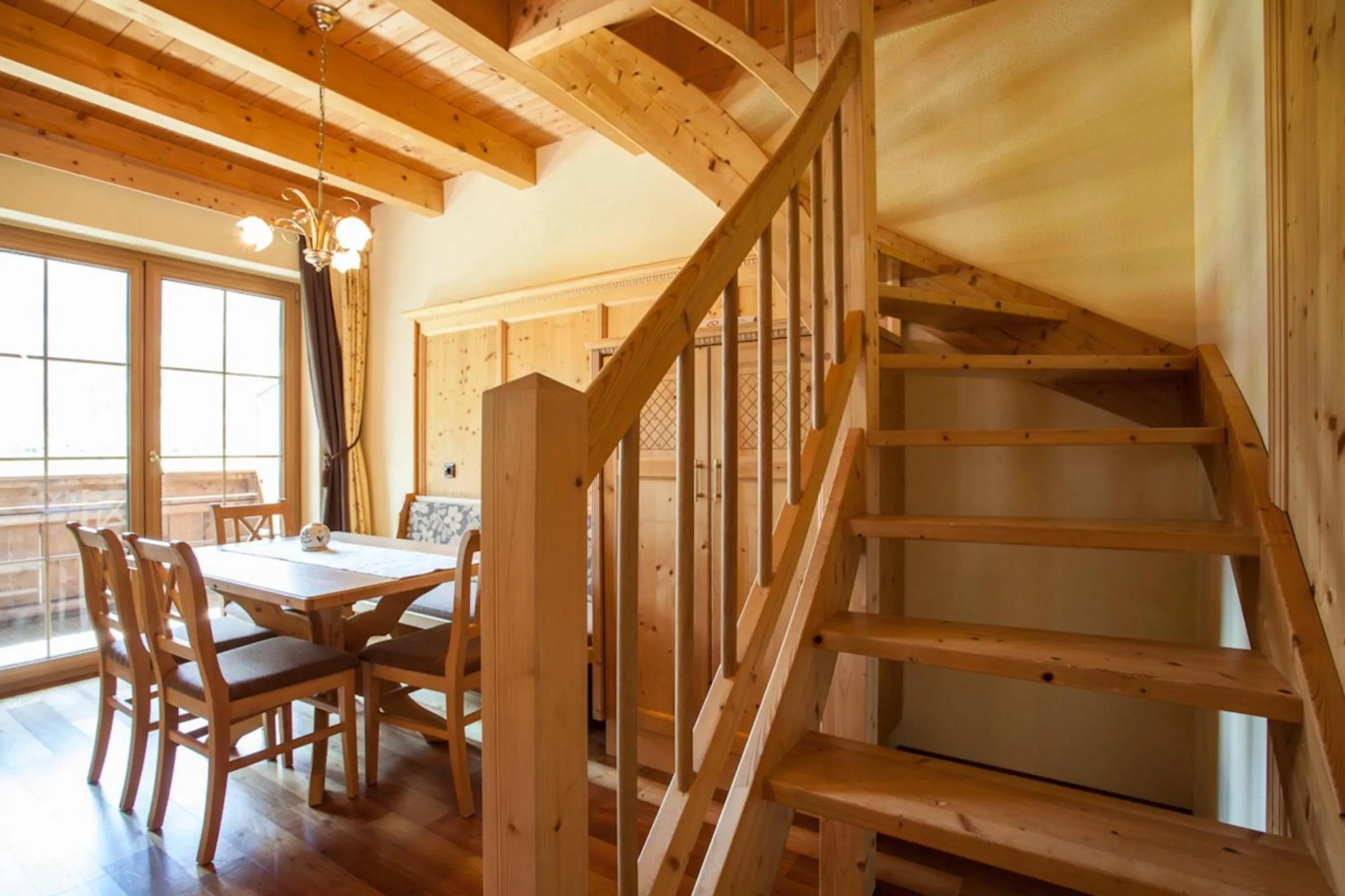 Dining area in Rimlhof by A CASA