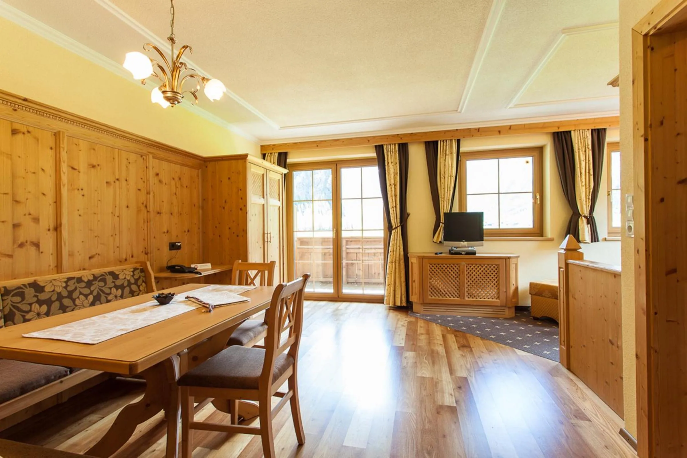 Dining area in Rimlhof by A CASA