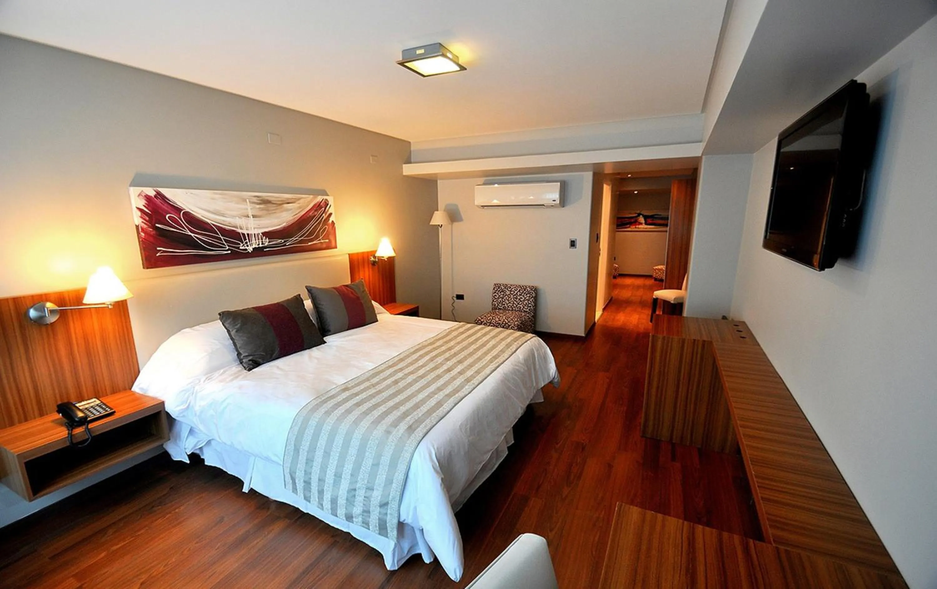 Bed in Hotel Bicentenario Suites & Spa