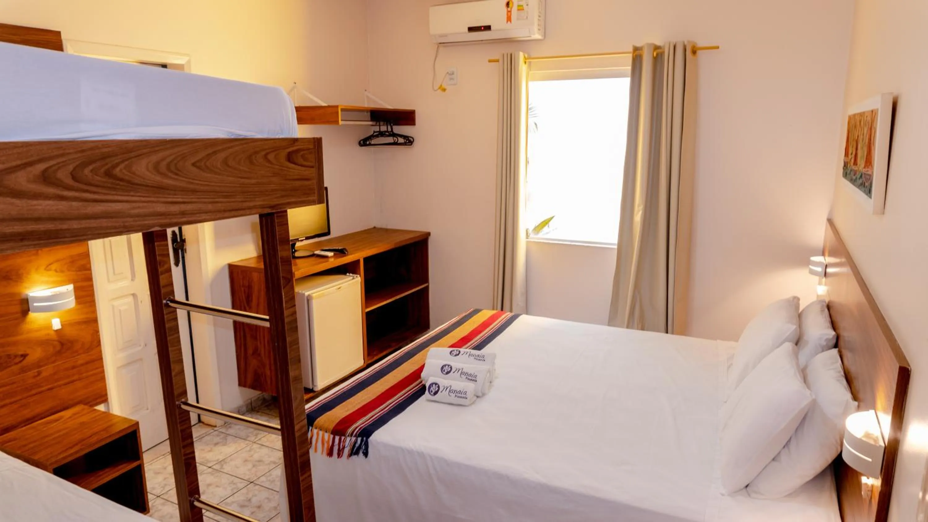 Bed in Pousada Manaia