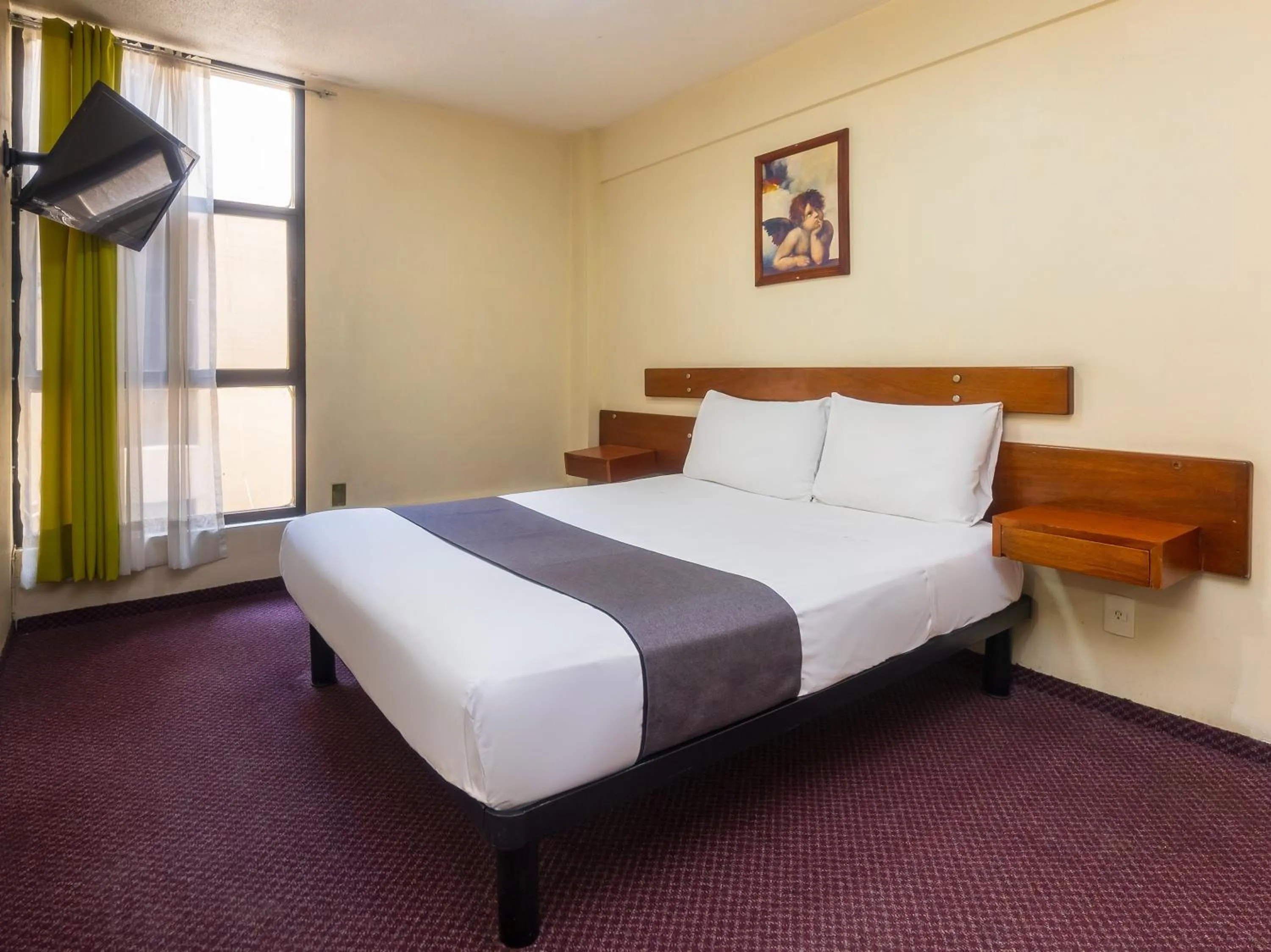 Bedroom, Bed in Capital O Hotel Suites Marne, Mexico City