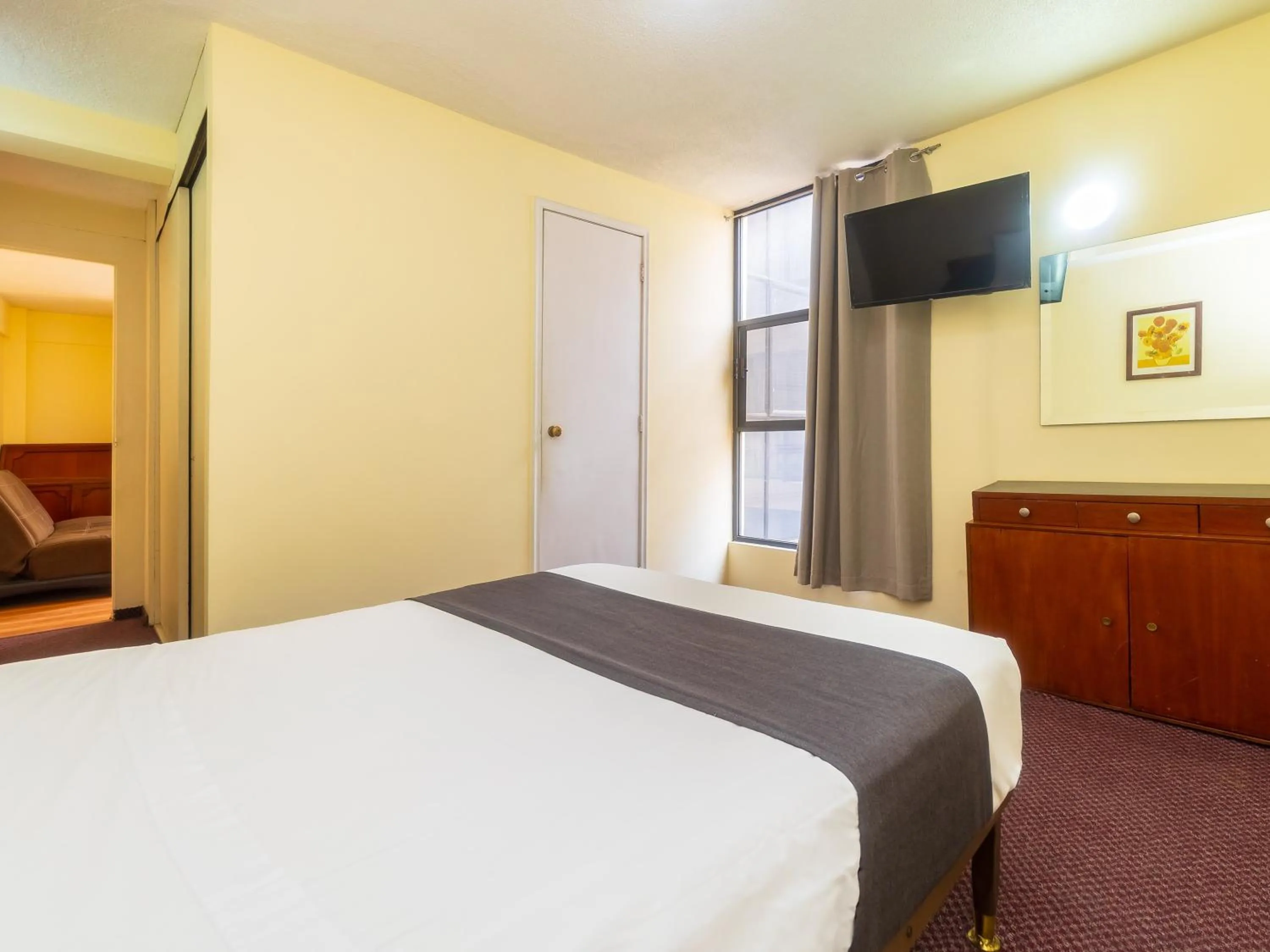 Bedroom, Bed in Capital O Hotel Suites Marne, Mexico City