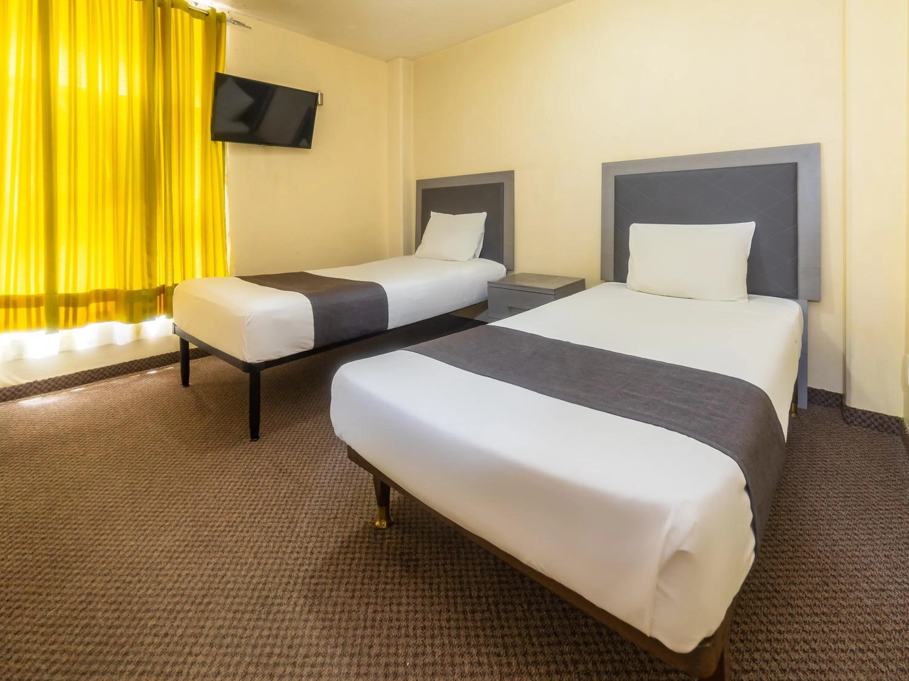 Bedroom, Bed in Capital O Hotel Suites Marne, Mexico City