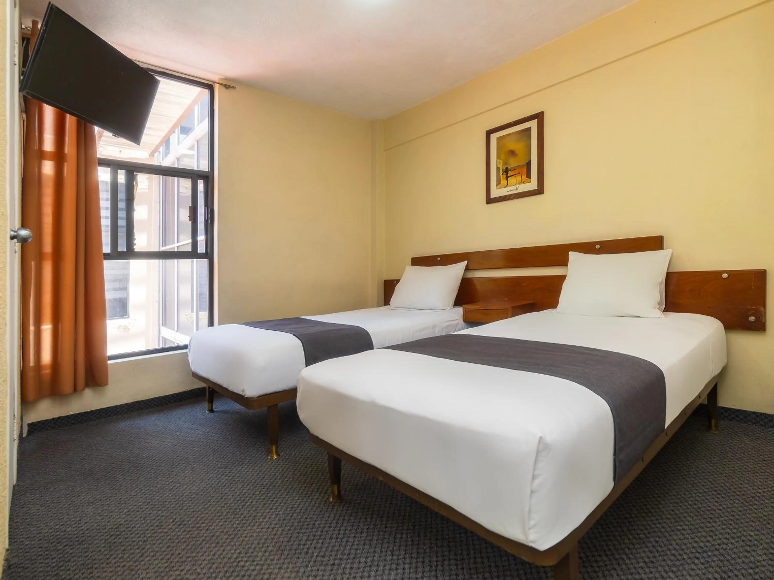 Bedroom, Bed in Capital O Hotel Suites Marne, Mexico City