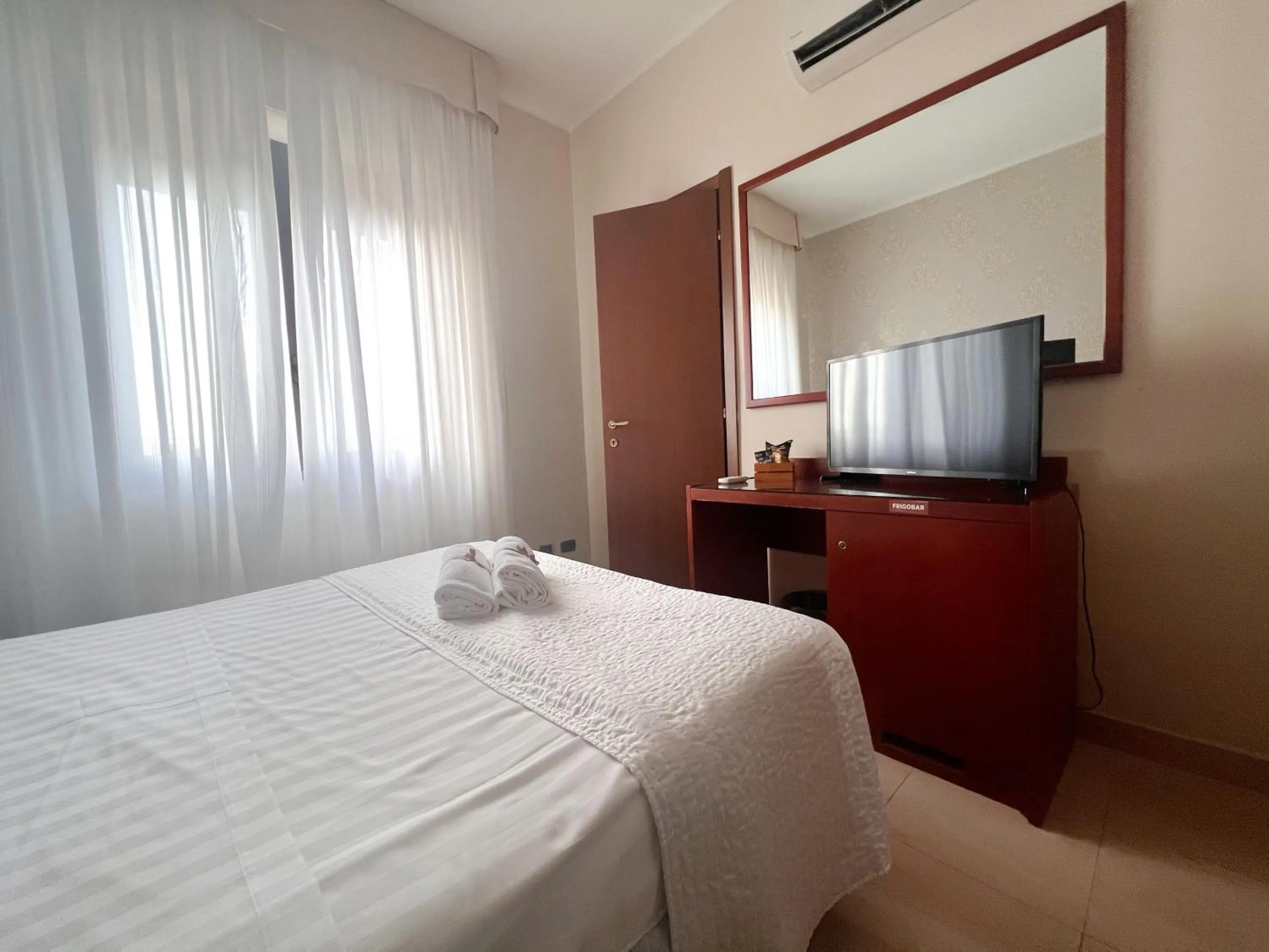 Bed in Hotel Paradiso