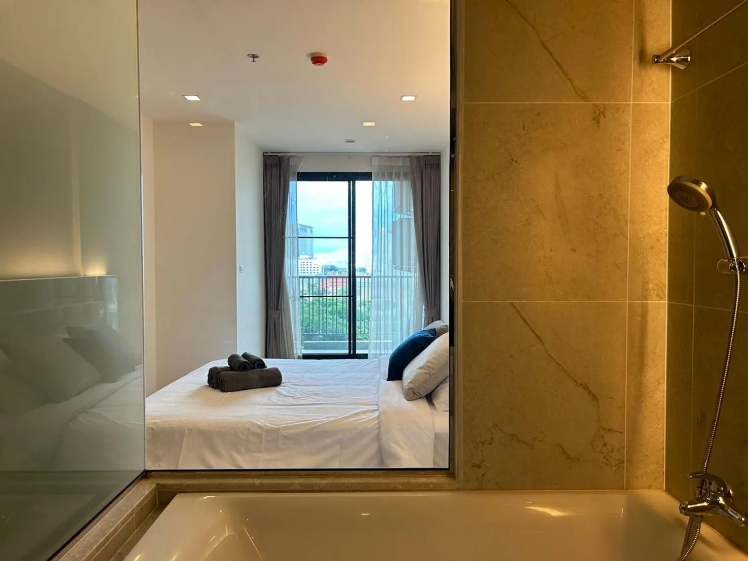 Bathroom, Bed in The Astra Residence