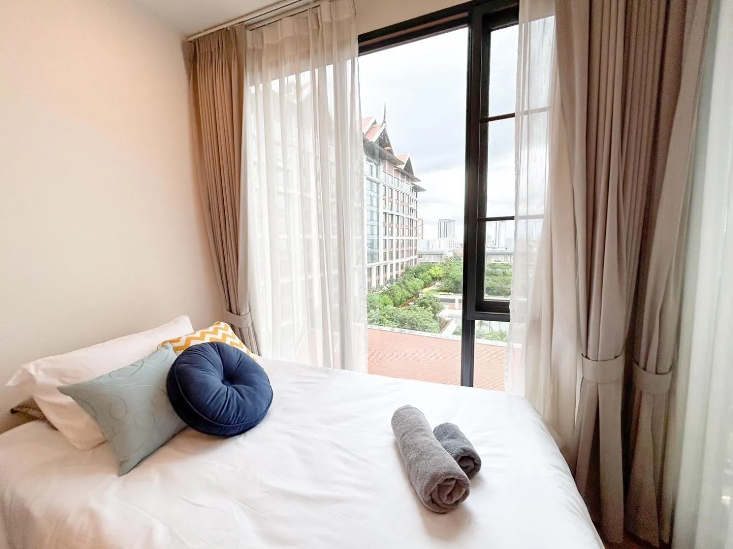 Bed in The Astra Residence