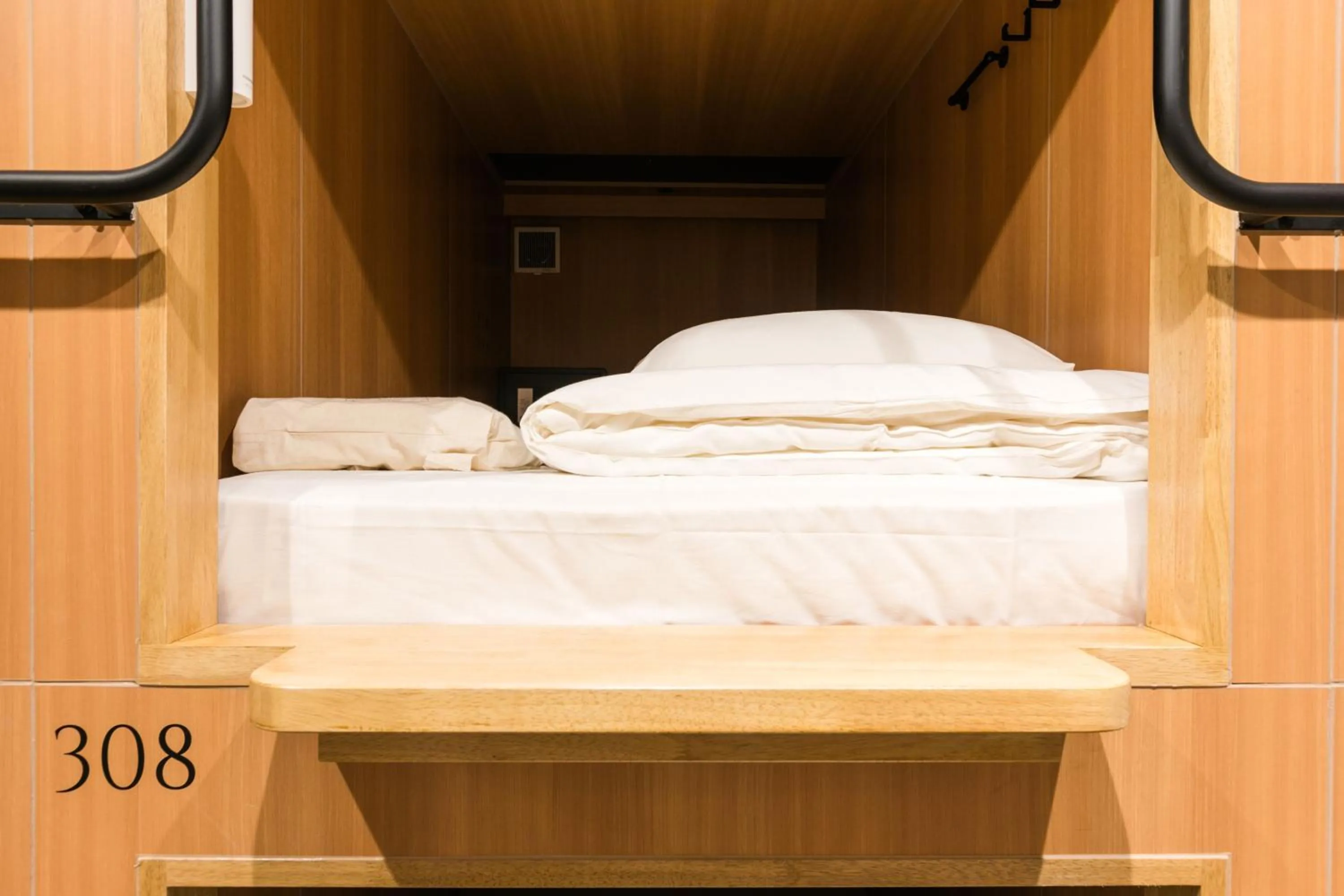 Bed in TSUKIMI HOTEL