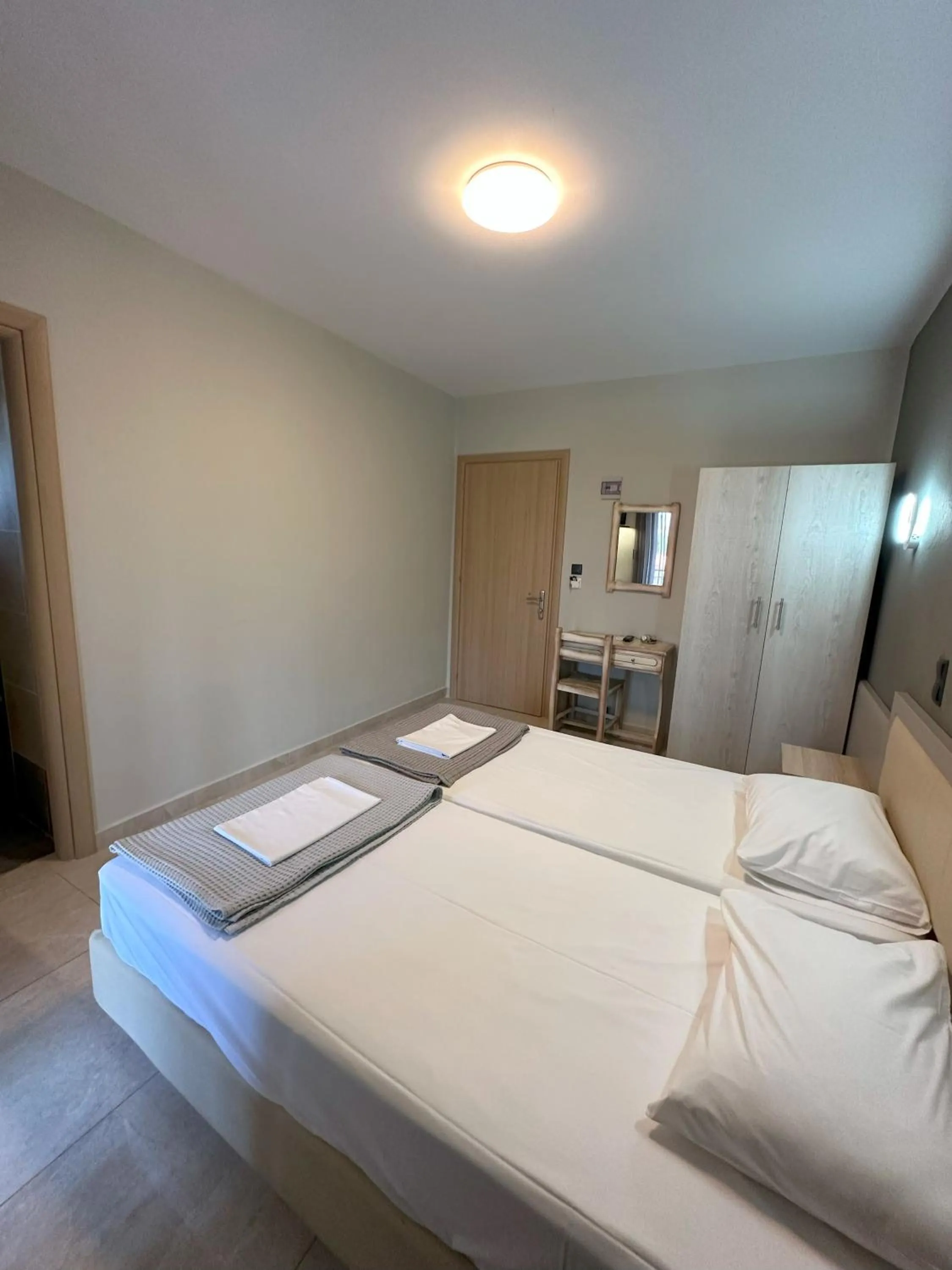 Bed in Hotel Afrodite