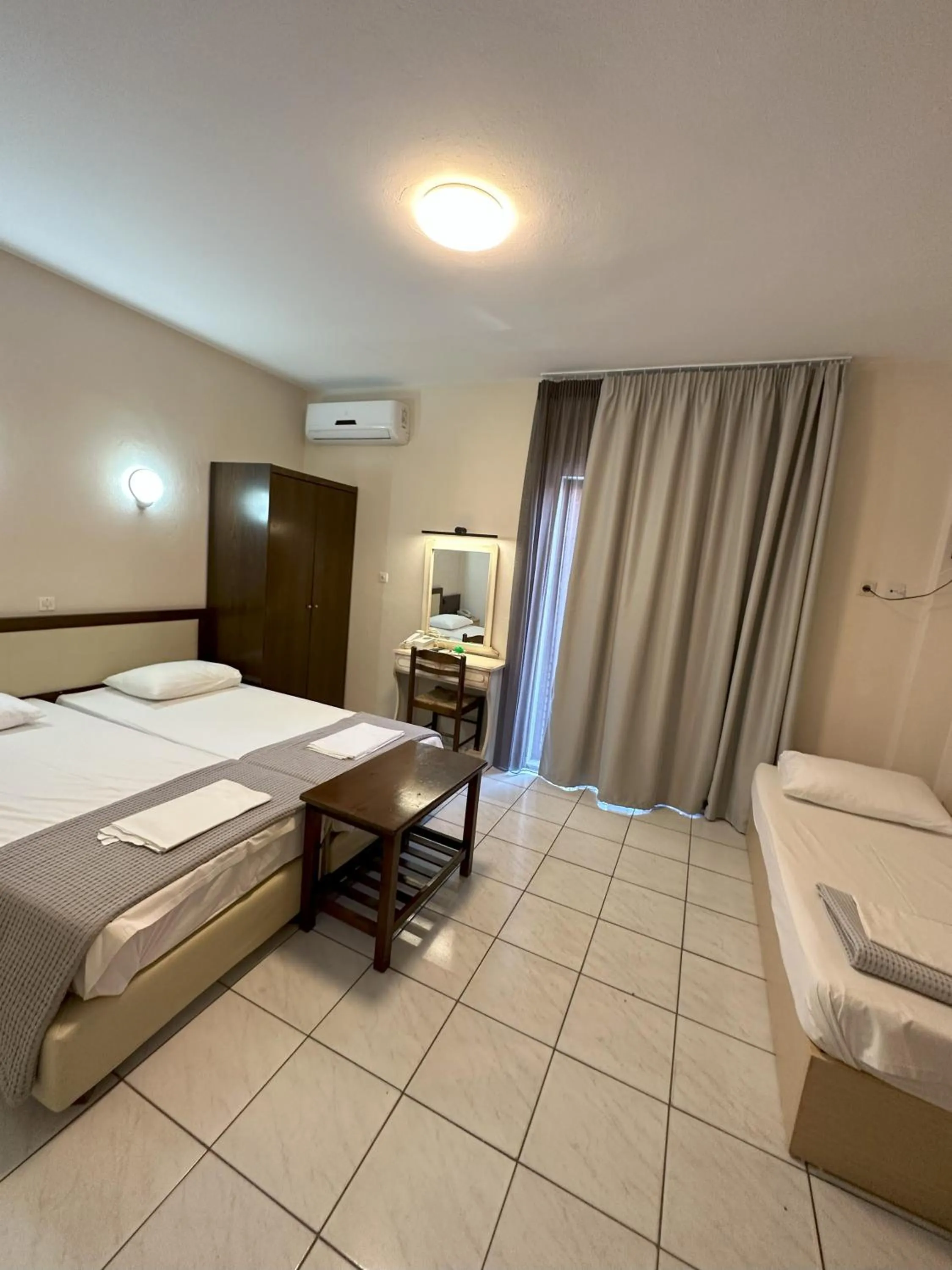 Bed in Hotel Afrodite