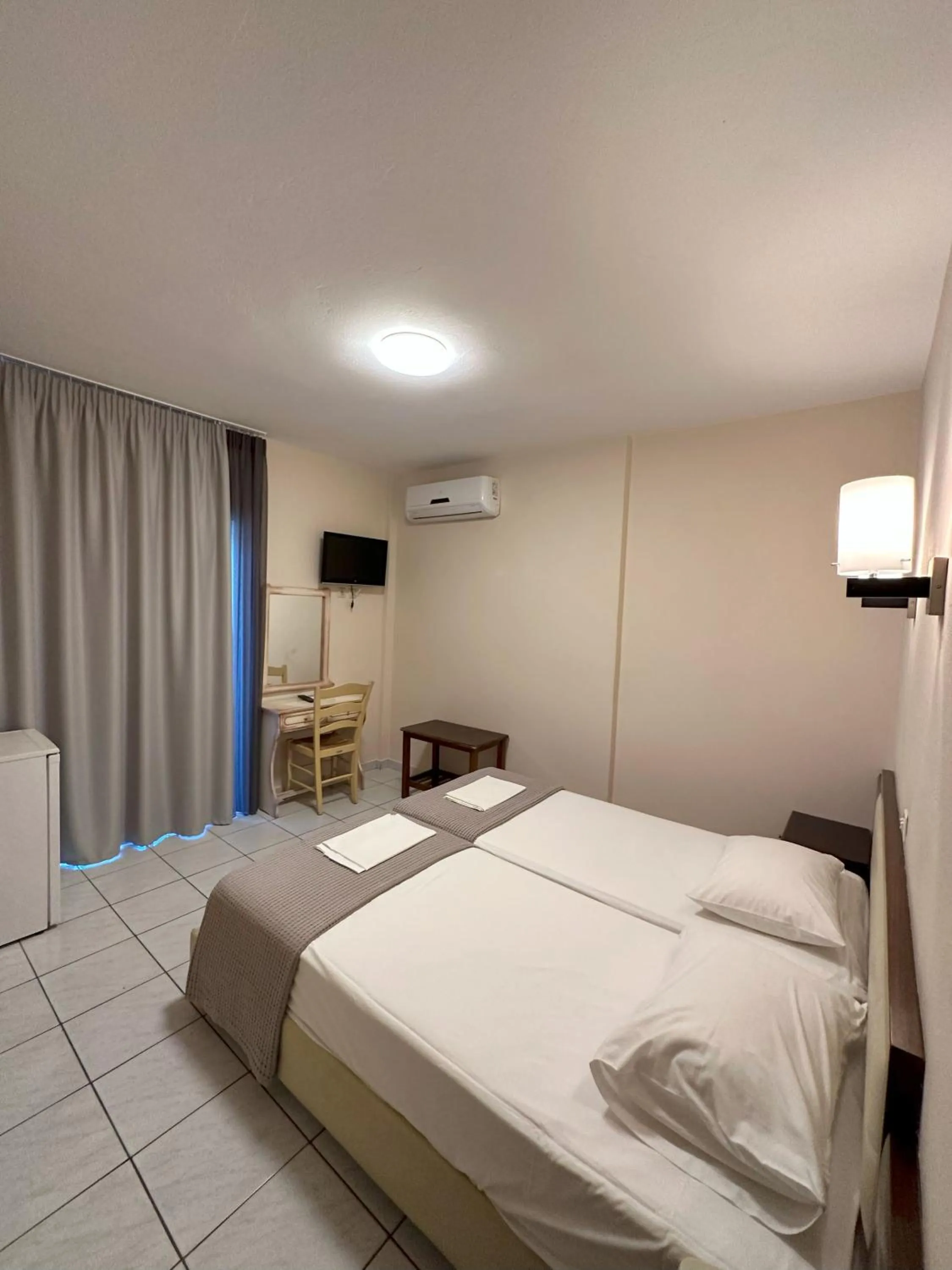 Bed in Hotel Afrodite