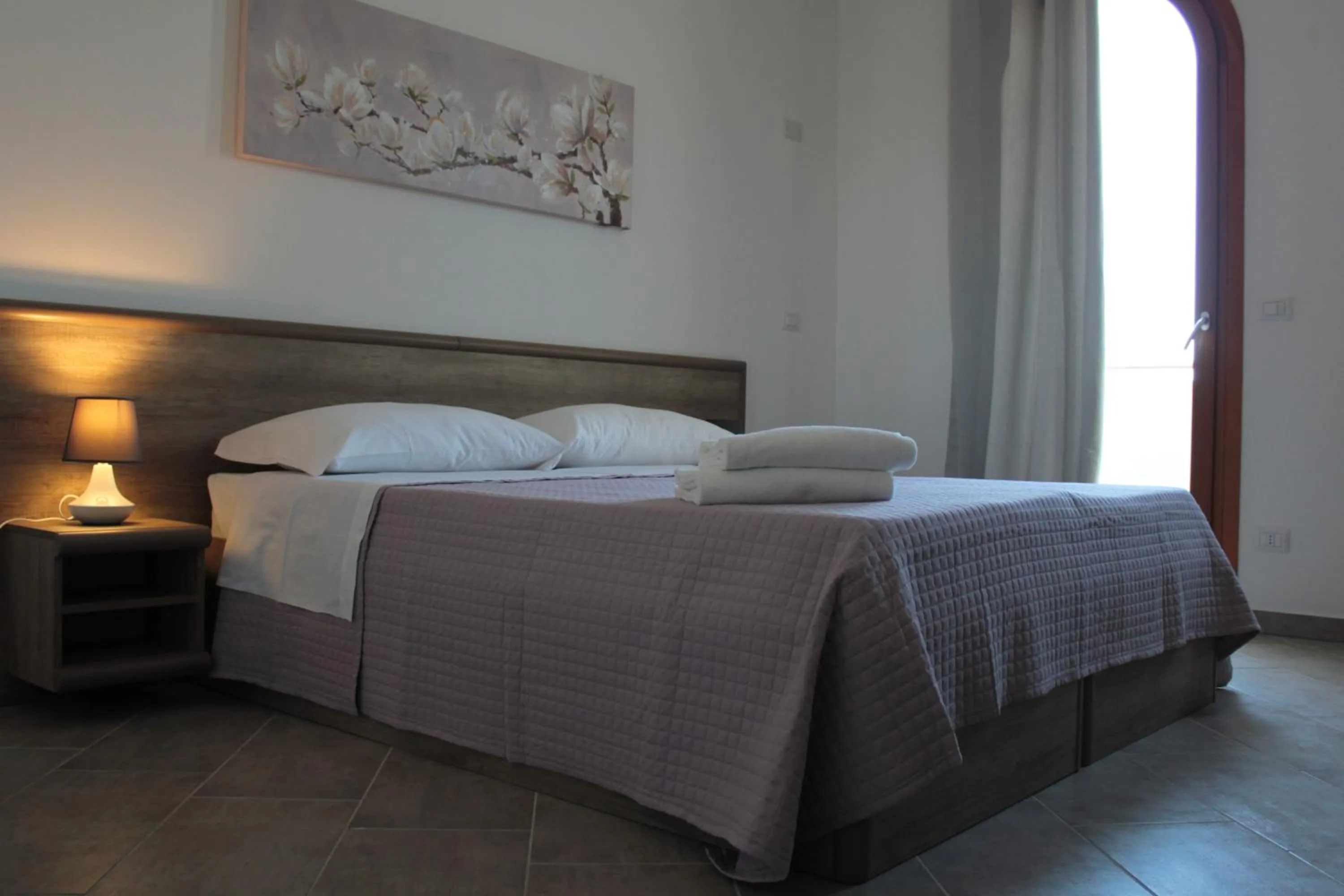 Bed in Mansio Residence & Hotel
