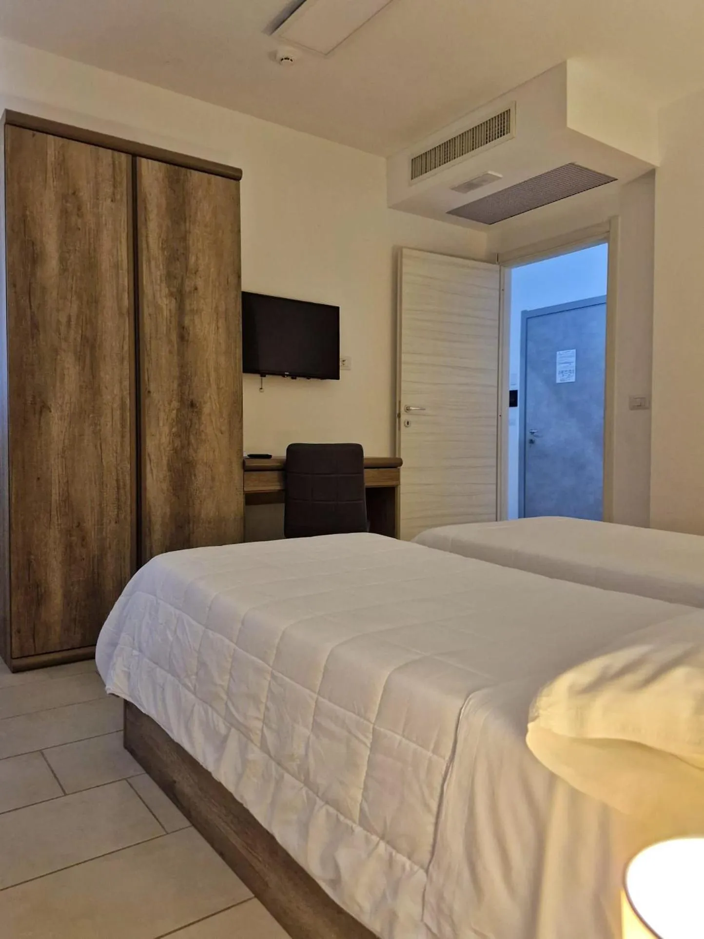 Bed in Mansio Residence & Hotel