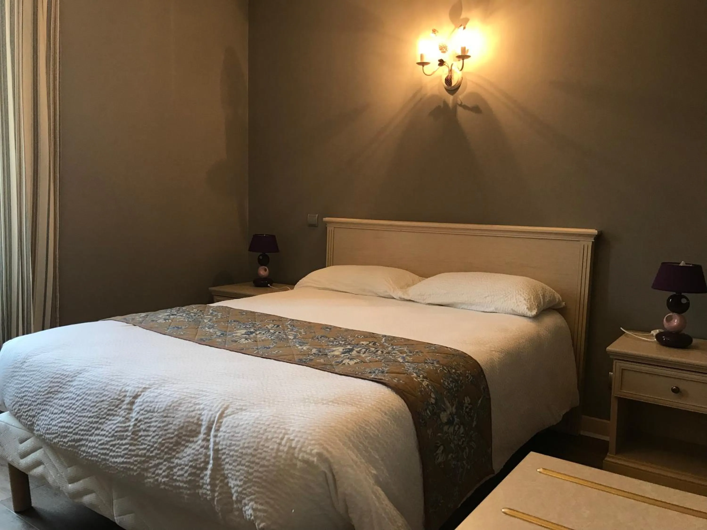 Bed in Logis hotel Saint-Joseph