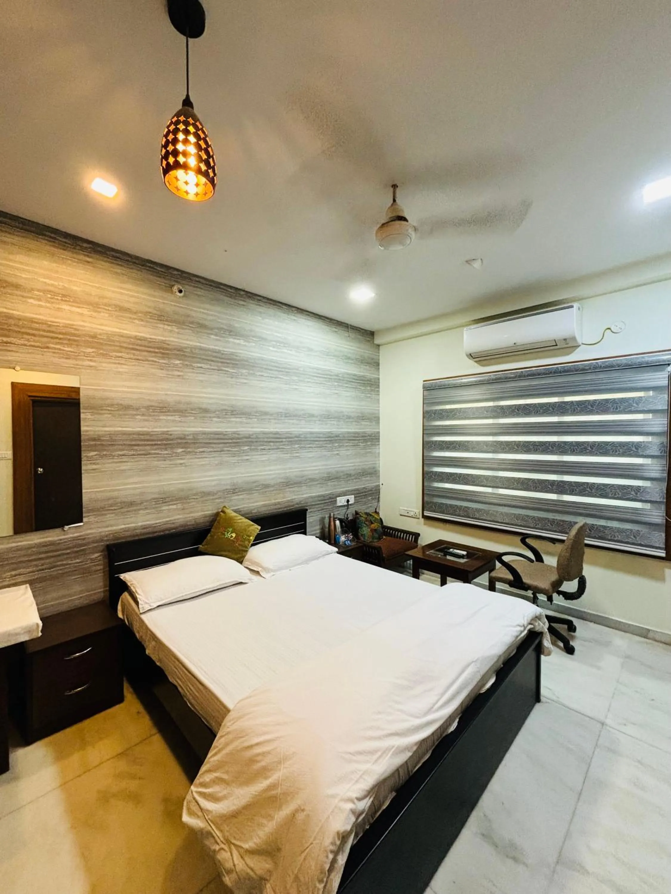 Bed in Royal Palms Luxury Service Apartment