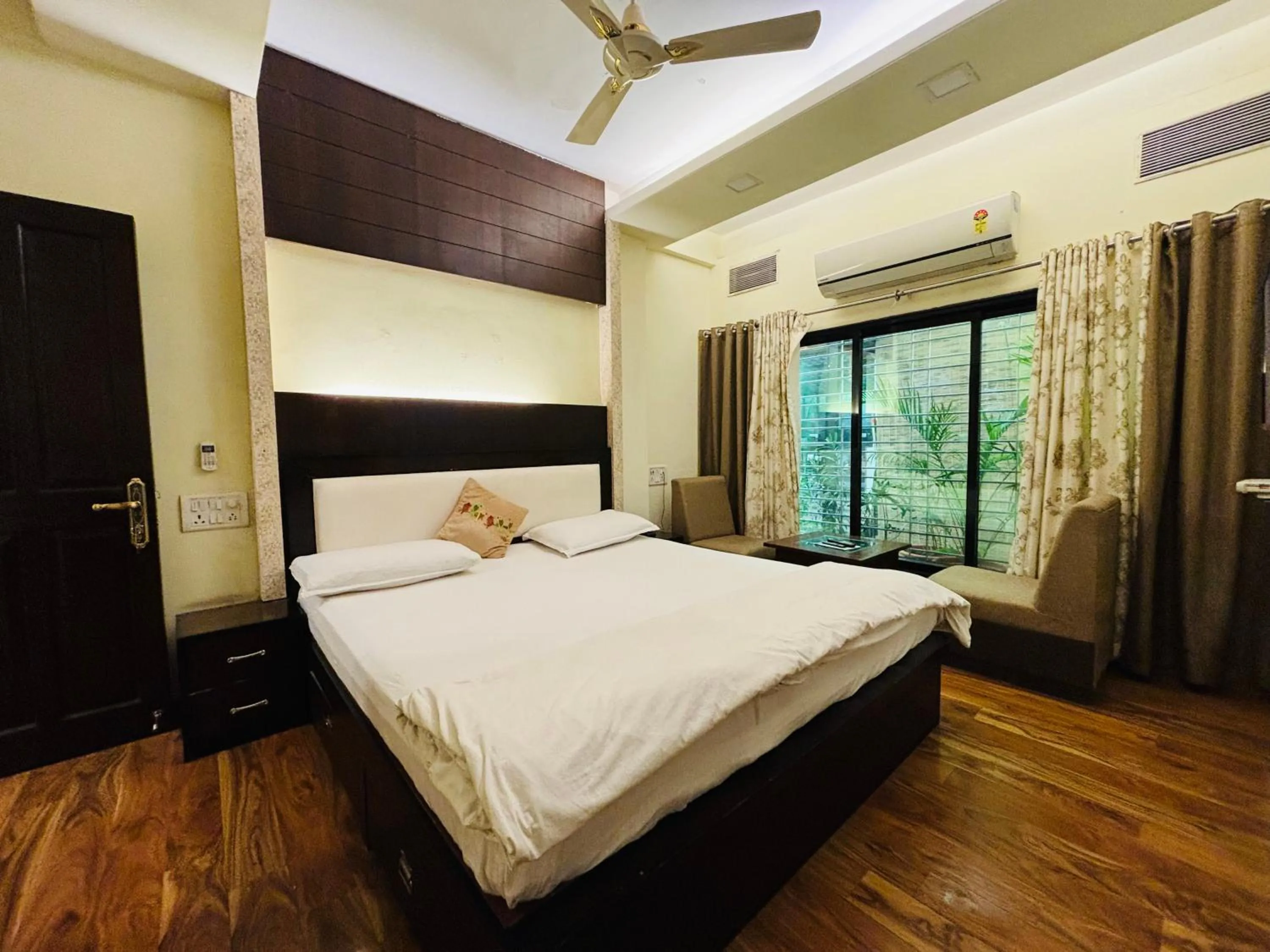 Bed in Royal Palms Luxury Service Apartment