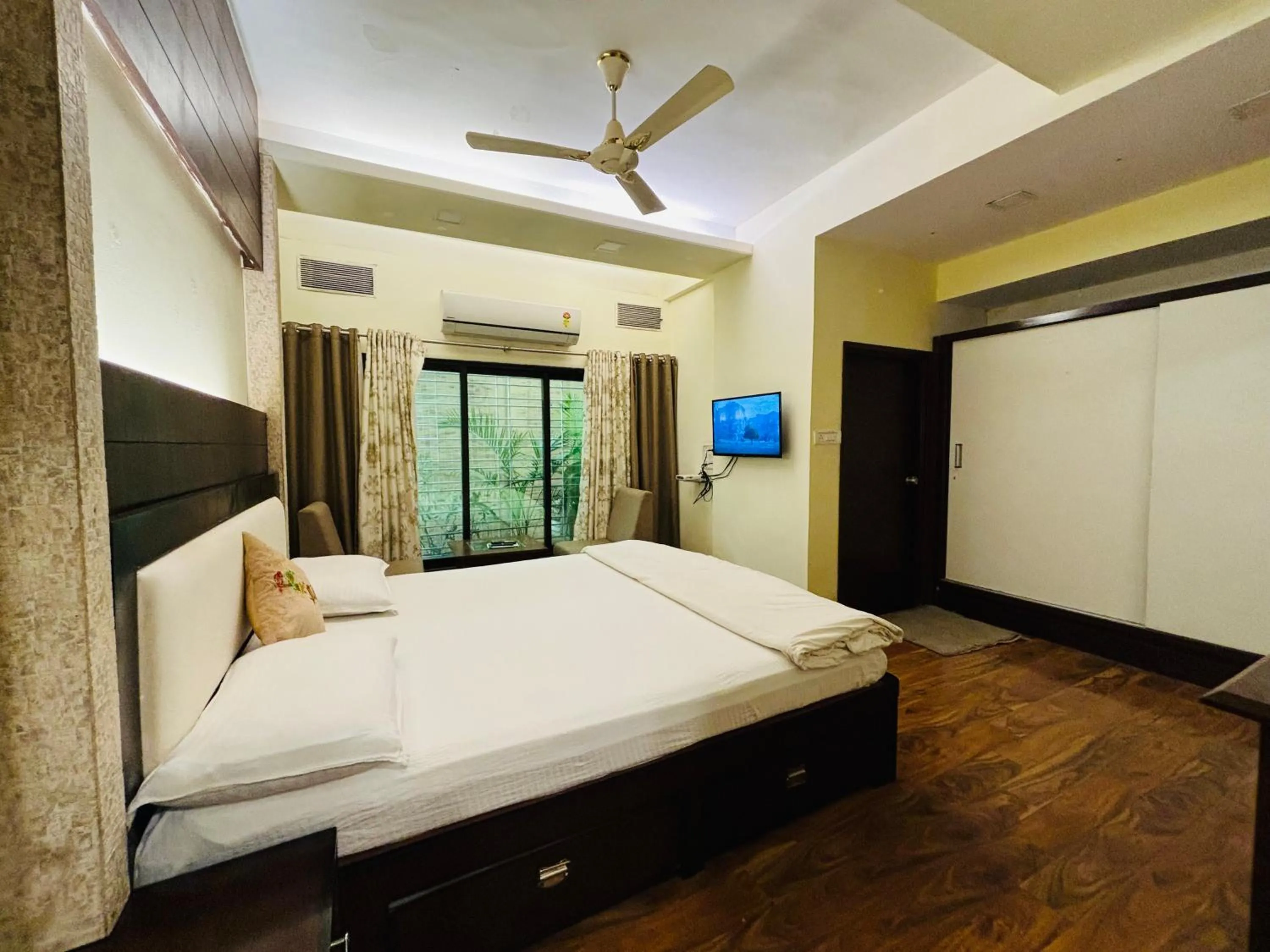 Bed in Royal Palms Luxury Service Apartment