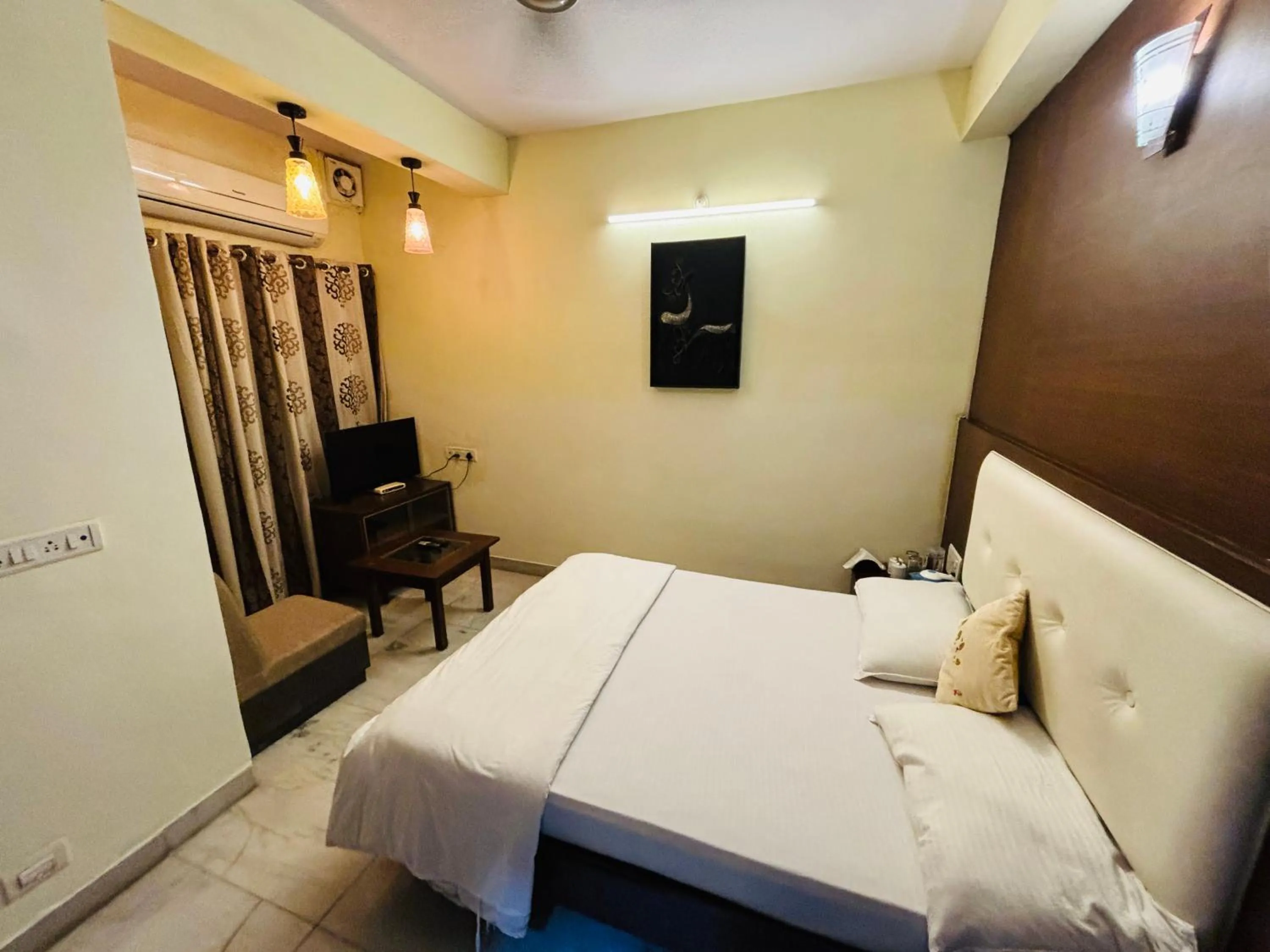 Bed in Royal Palms Luxury Service Apartment