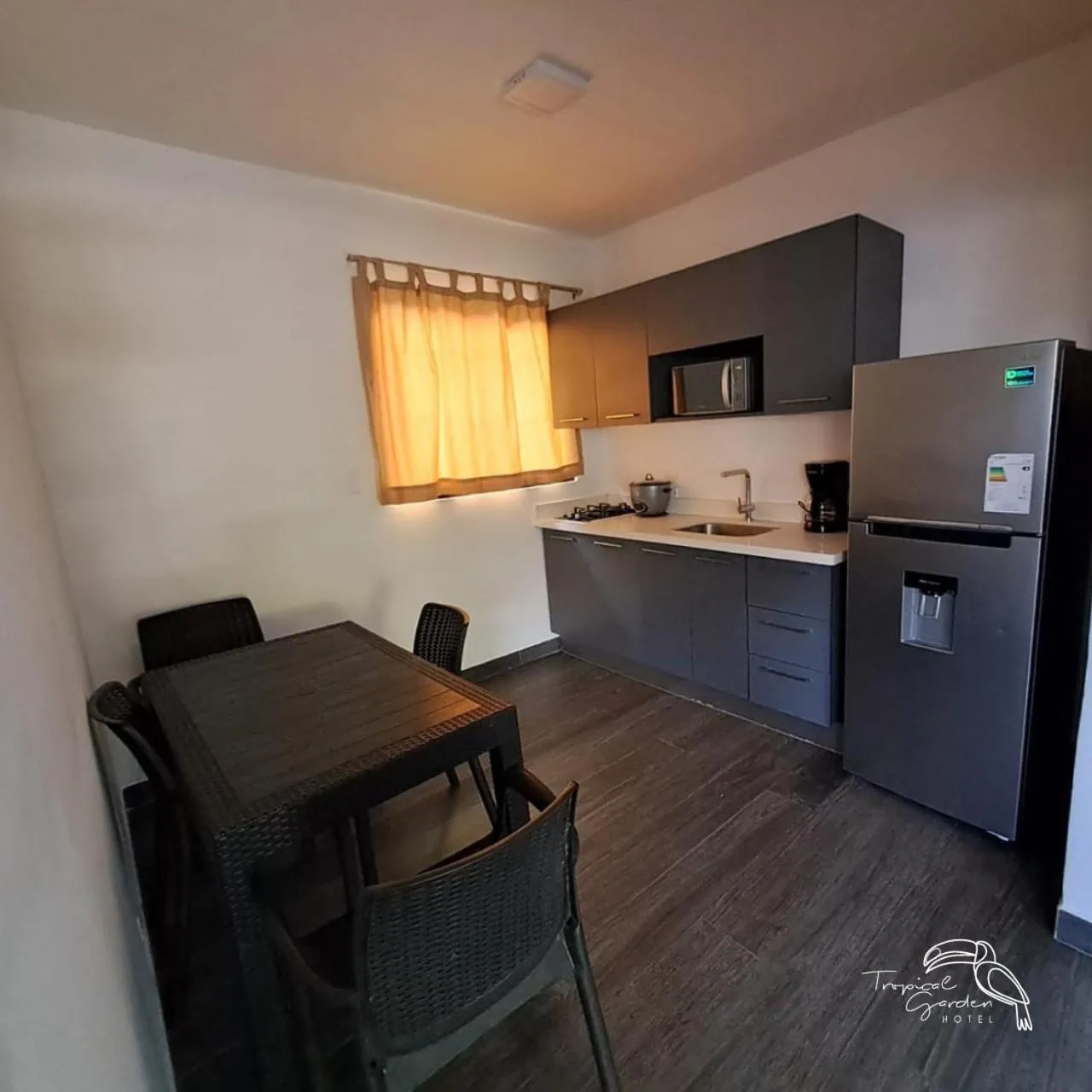 Kitchen or kitchenette in Tropical Garden Hotel