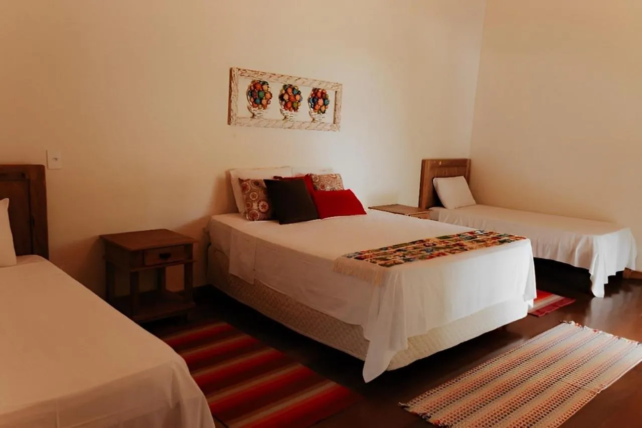 Bed in Hotel Pousada Chalé das Flores
