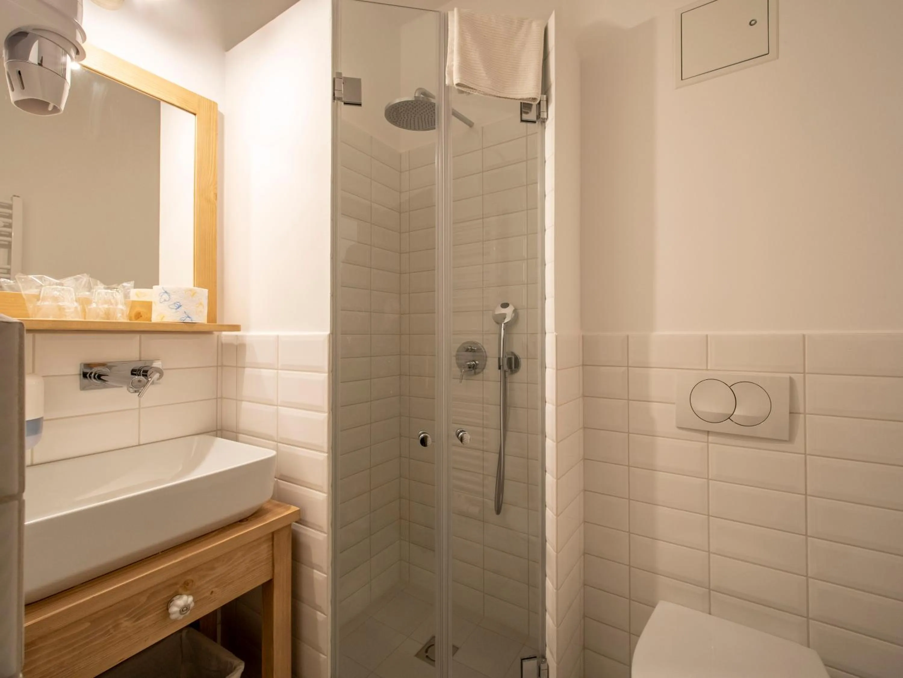 Bathroom in Berghi Hotel and Apartments
