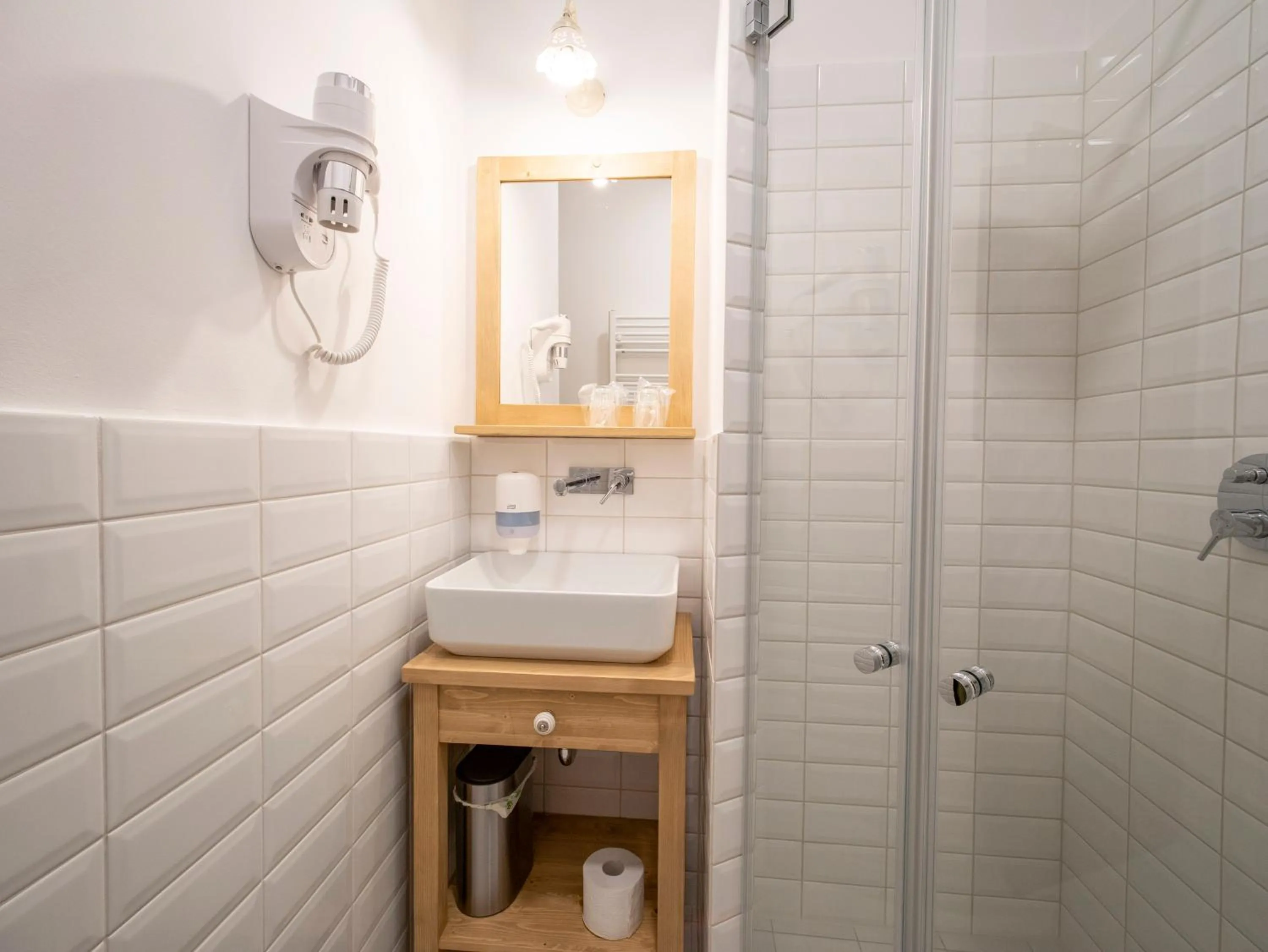 Bathroom in Berghi Hotel and Apartments