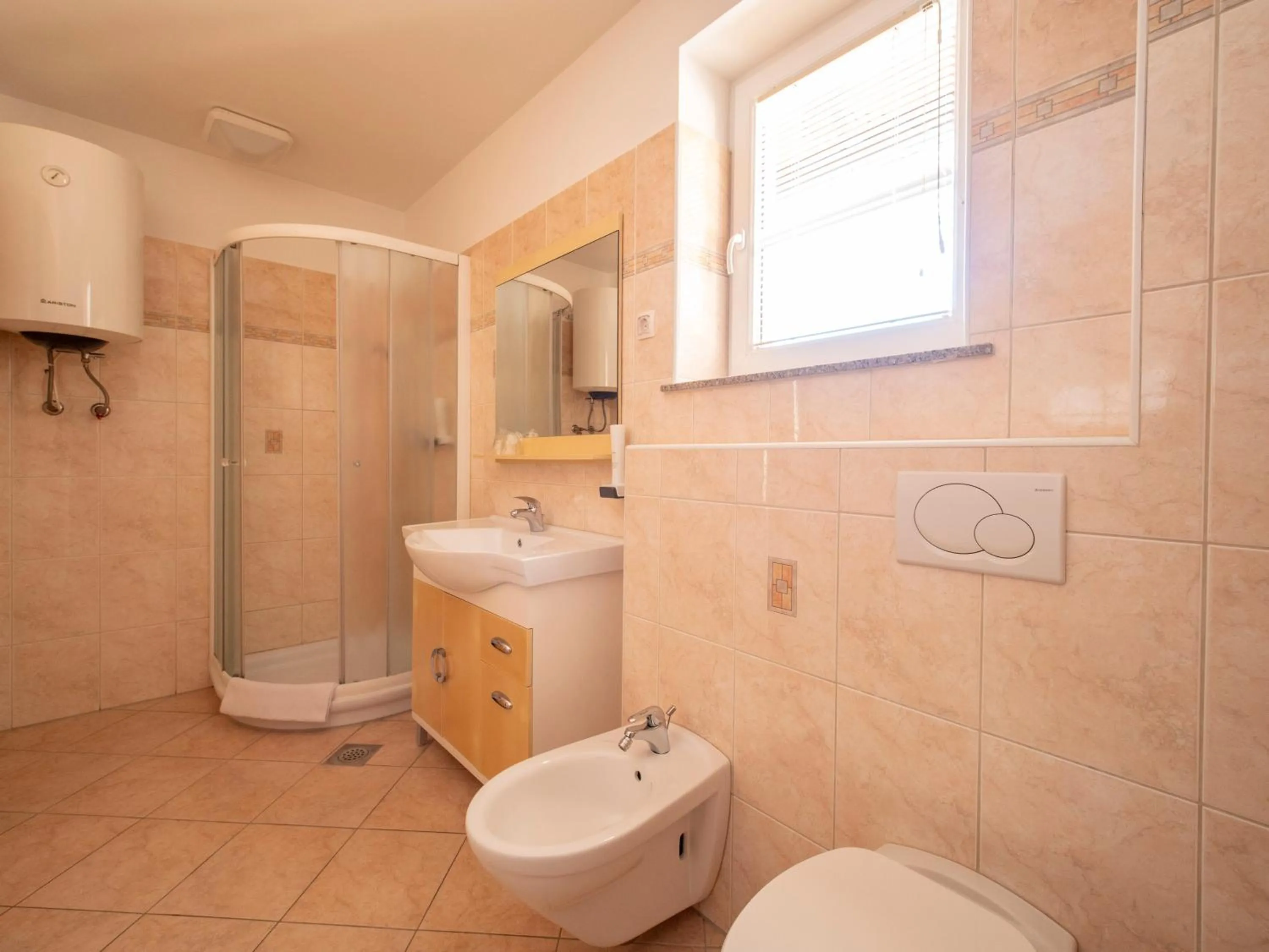 Bathroom in Berghi Hotel and Apartments