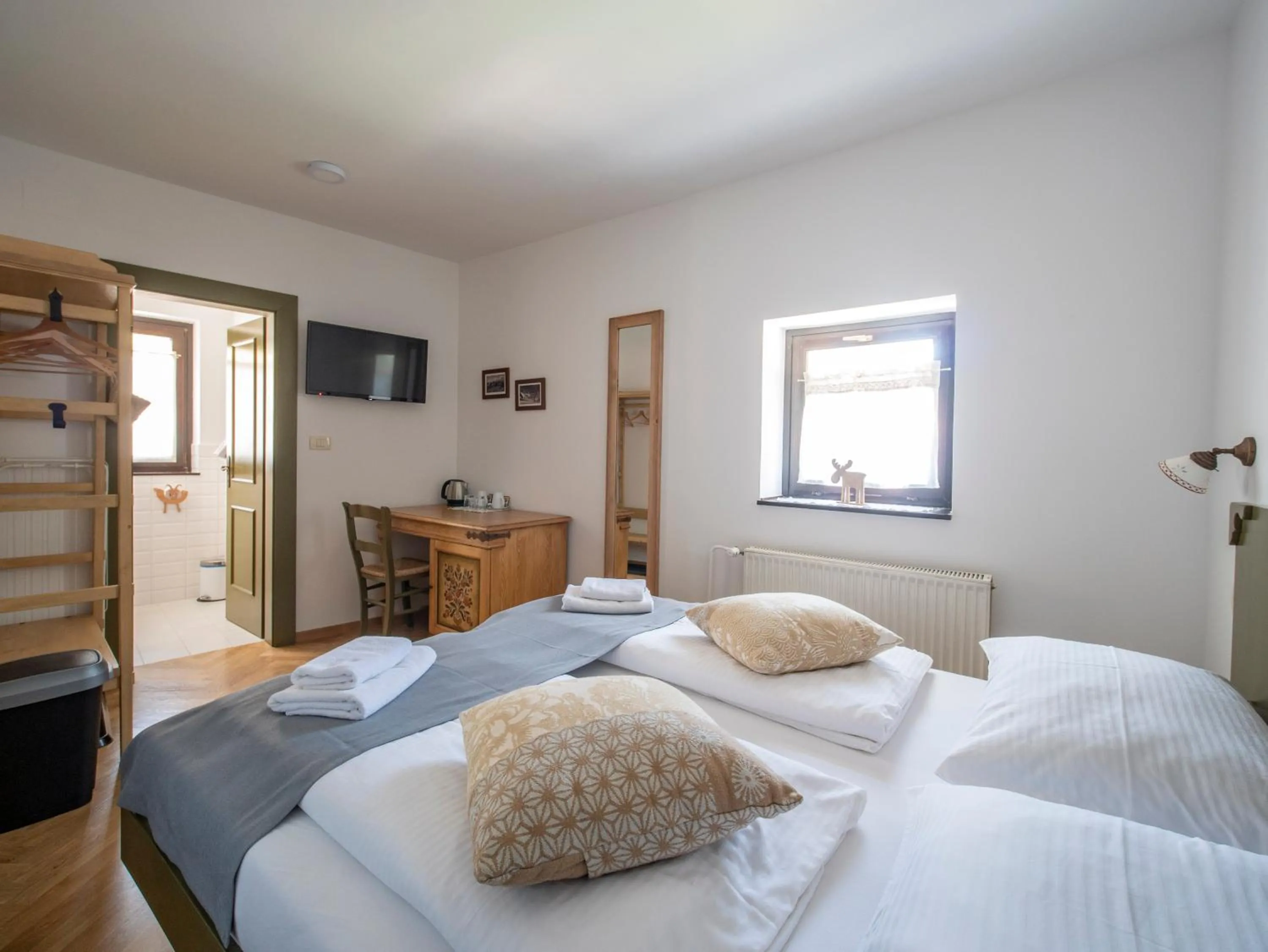 Bed in Berghi Hotel and Apartments