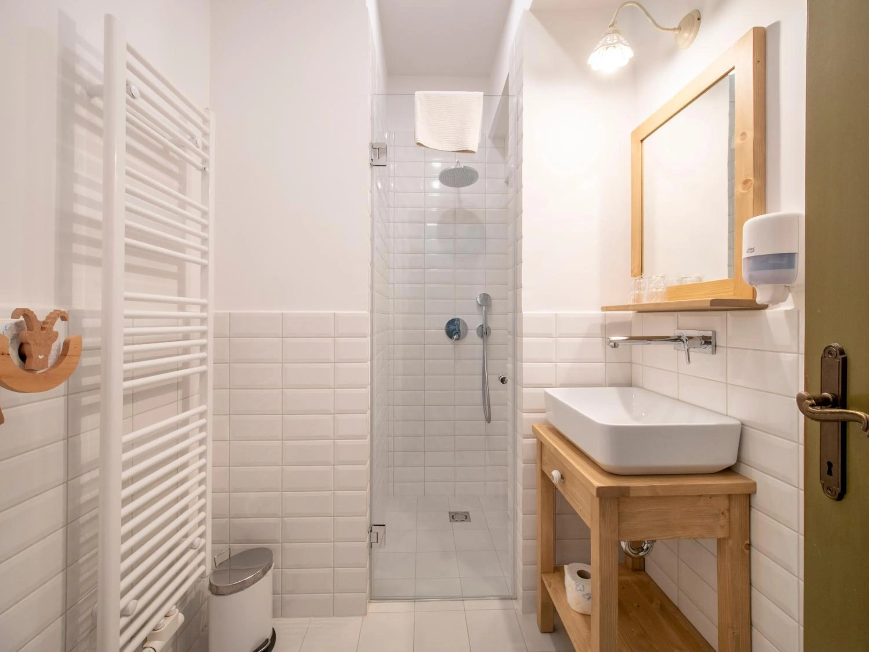 Bathroom in Berghi Hotel and Apartments